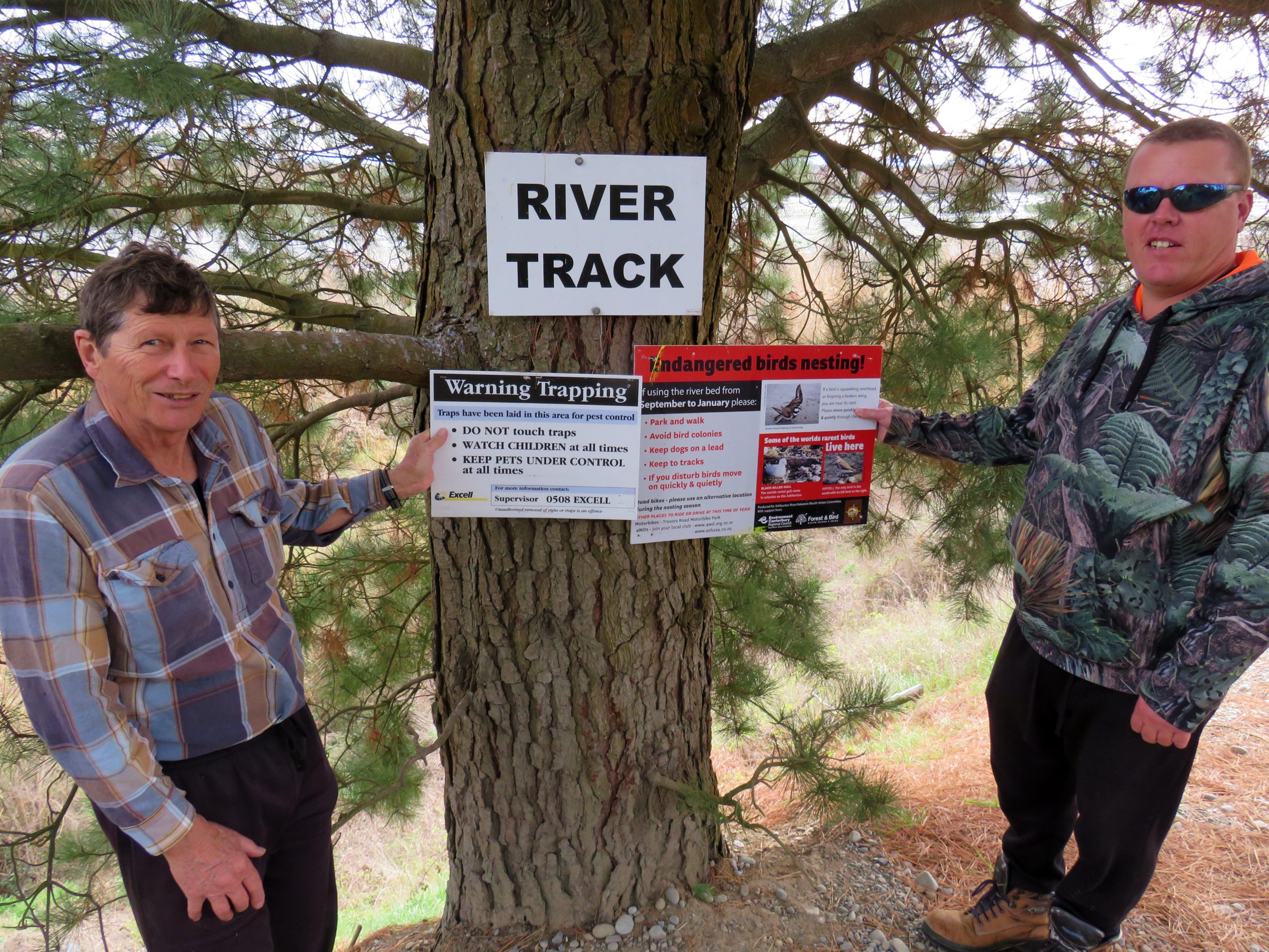 Hakatere residents Dennis Gant and Robert Mann with signs to be used when the new predator...