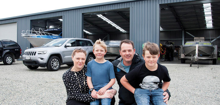 Te Anau owner-operator Christine and Mark Wallace with children Zane and Morgan are ready to ...