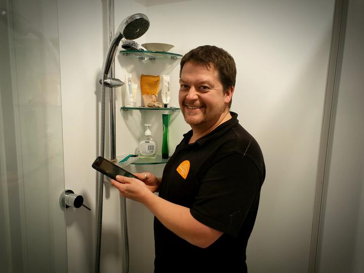 Sustainability Trust home assessor Karl Wheddon says phones in the shower are hampering efforts...