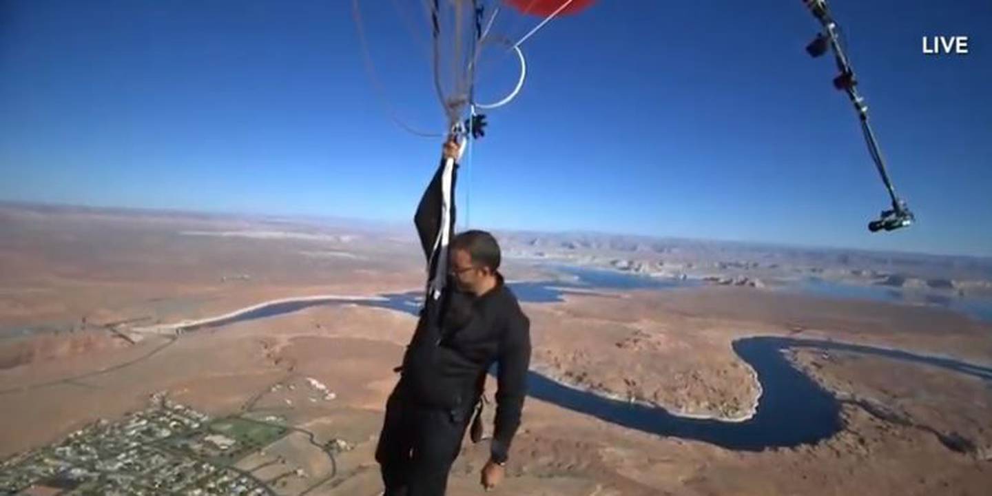 David Blaine reached 24,700 feet before letting go of the balloons and parachuting back down to...