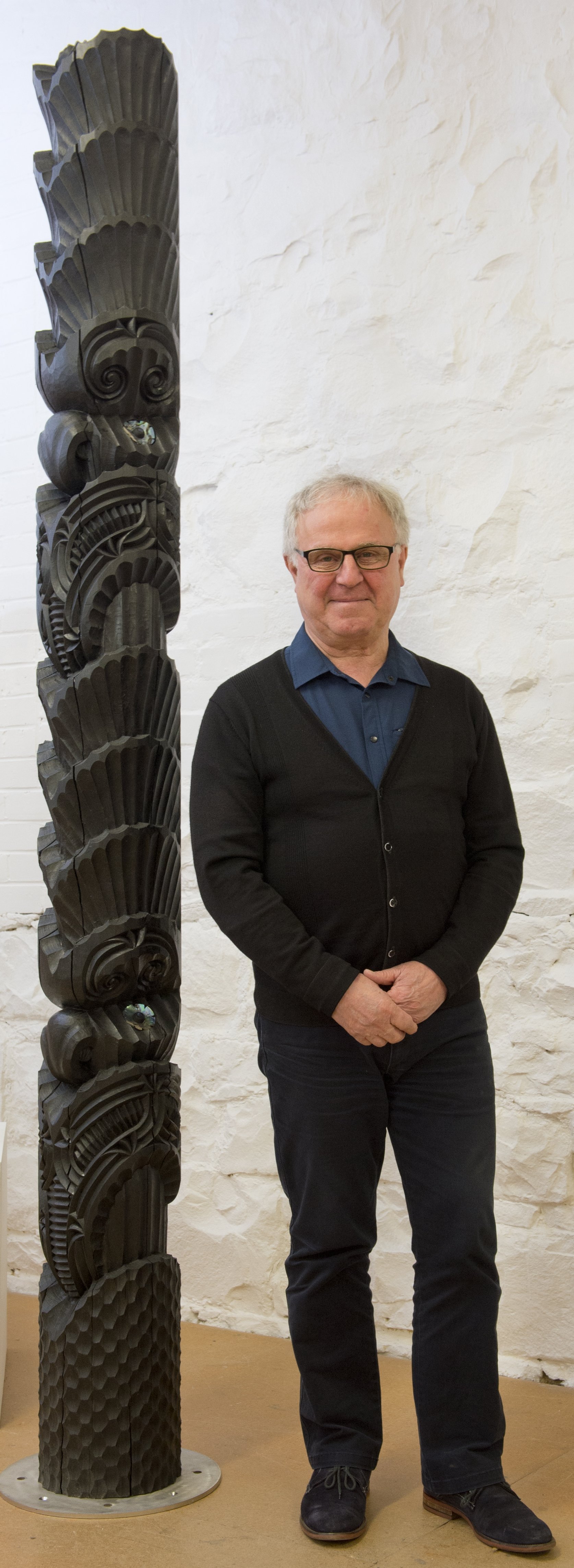 ‘‘Waitohu’’ curator Stephen Higginson with Chris Bailey’s Pou (2020). PHOTO: GERARD O’BRIEN