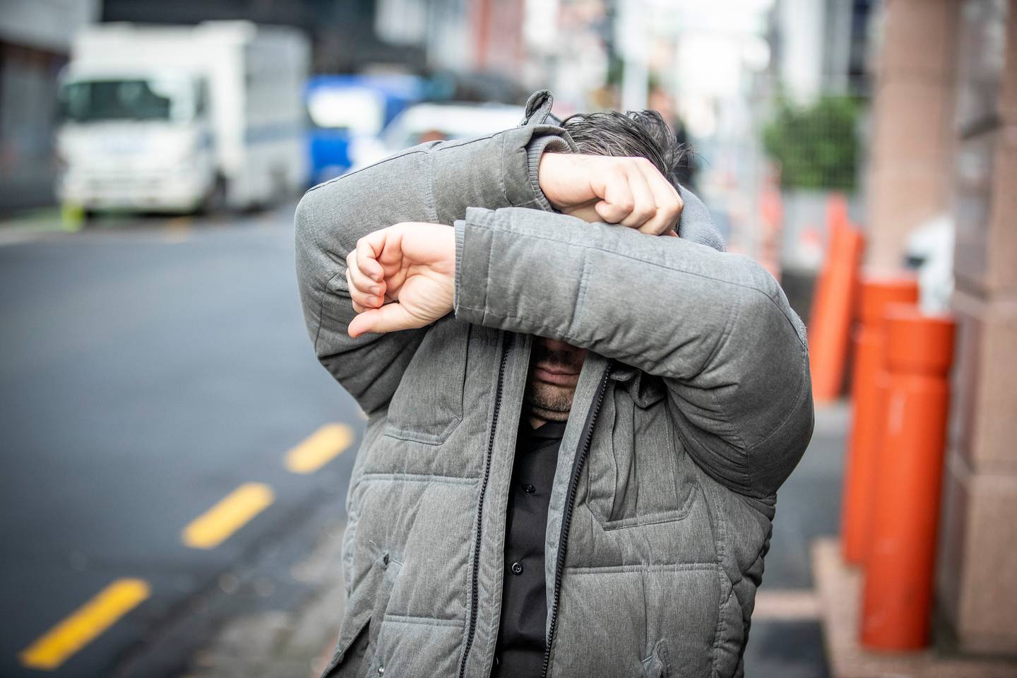 Convicted paedophile Nikola Michael Marinovich tries to evade cameras outside Auckland District...