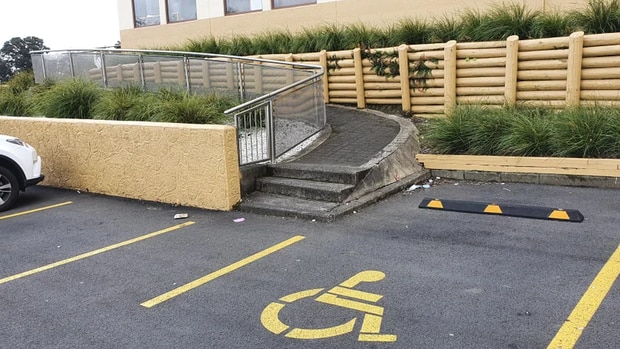 A Reddit user shared the image showing the disabled parking spot next to a ramp with steps to...