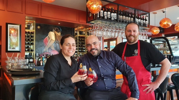 Pedro's By The Lake co-owners Maria De Leon, left, and Damian Brown, centre, toast the opening...