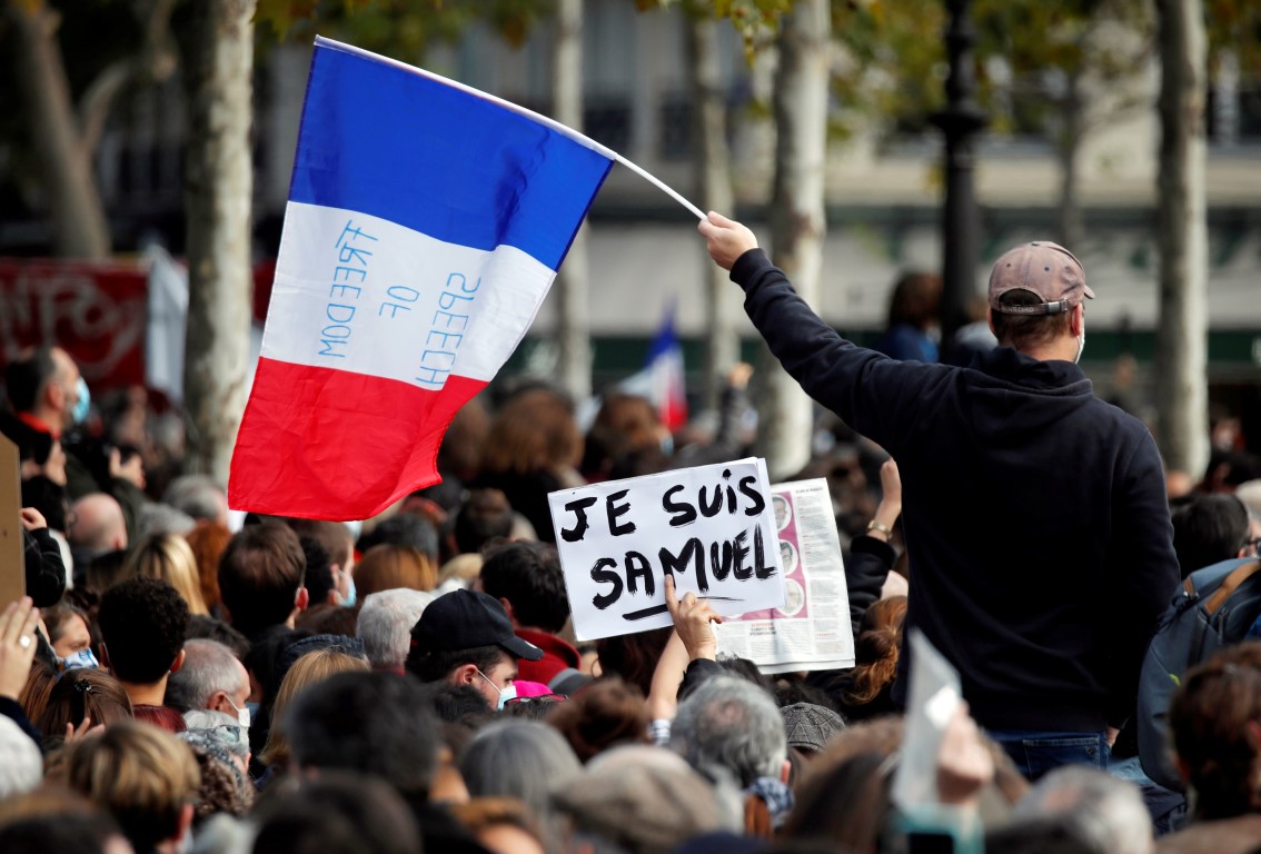 People gather at the Place de la Republique in Paris to pay tribute to Samuel Paty. Photo: Reuters