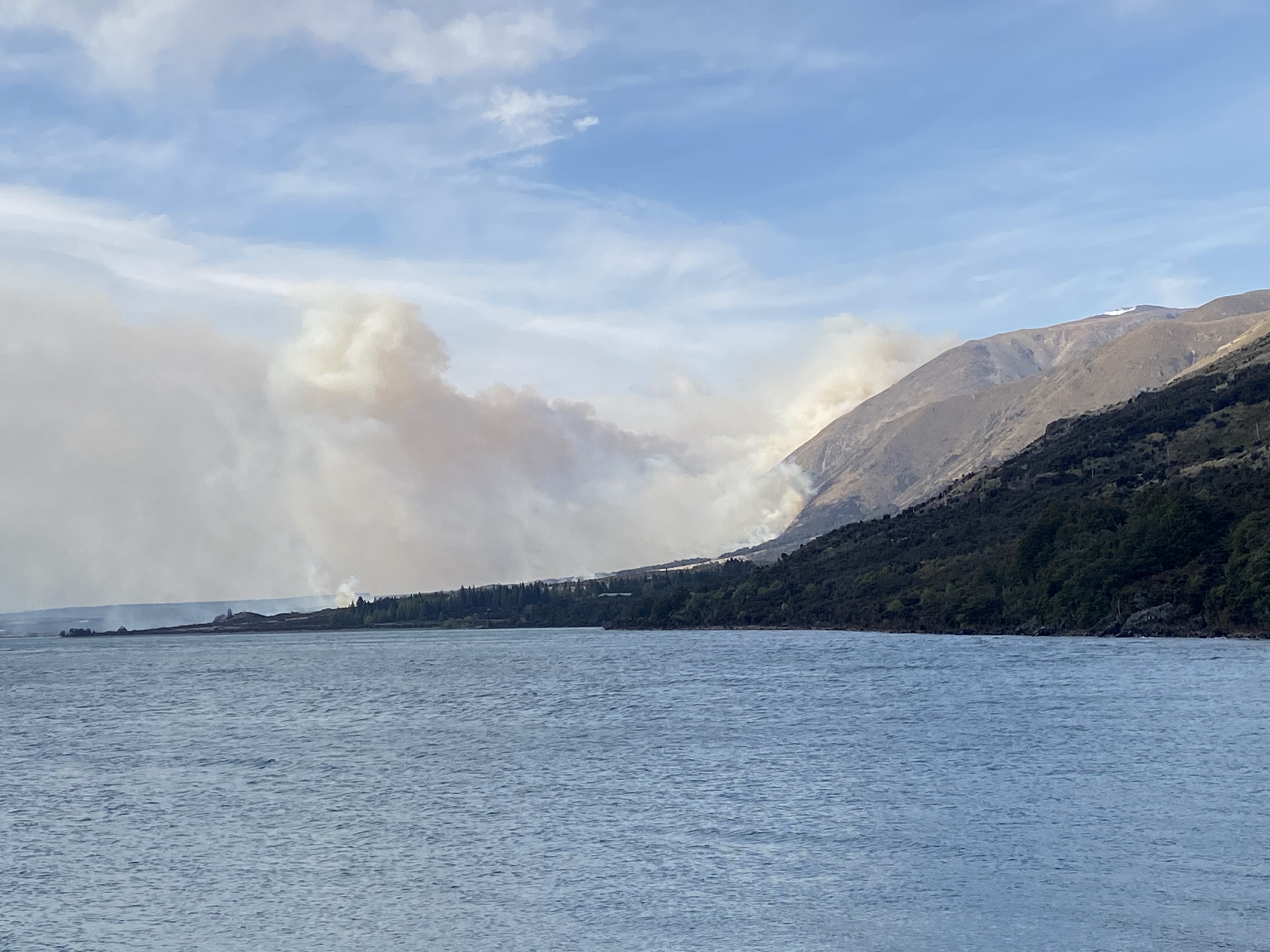 Smoke drifts as the blaze continues to burn earlier today. Photo: Andy Winneke