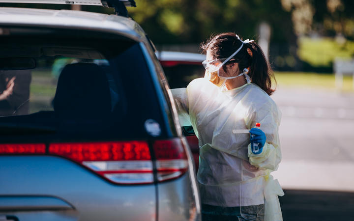 A health worker conducts a Covid-19 test. Photo: RNZ 