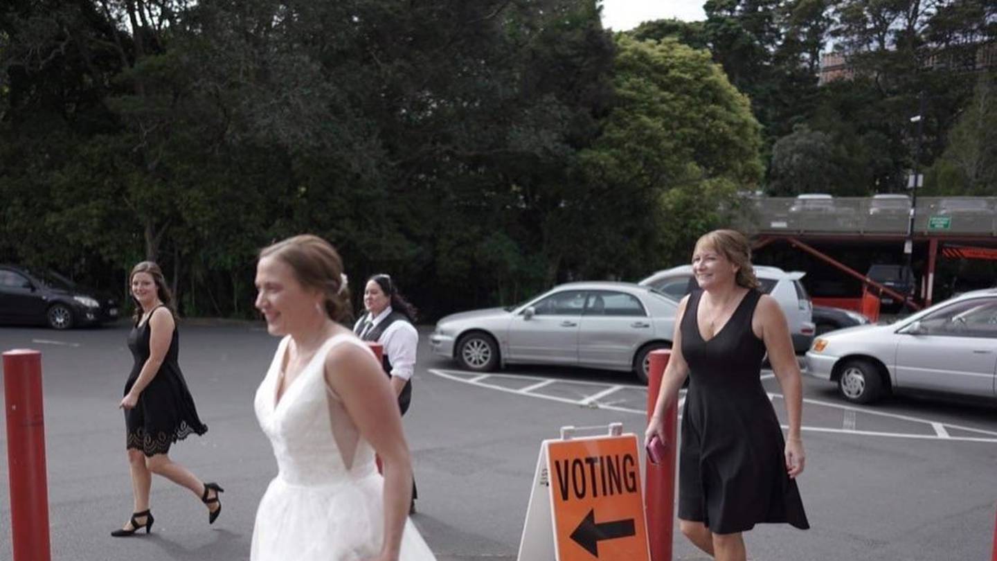 Bride Amberleigh Jack stopped at the Titirangi War Memorial to cast her vote. Photo / Ethan Lowry...