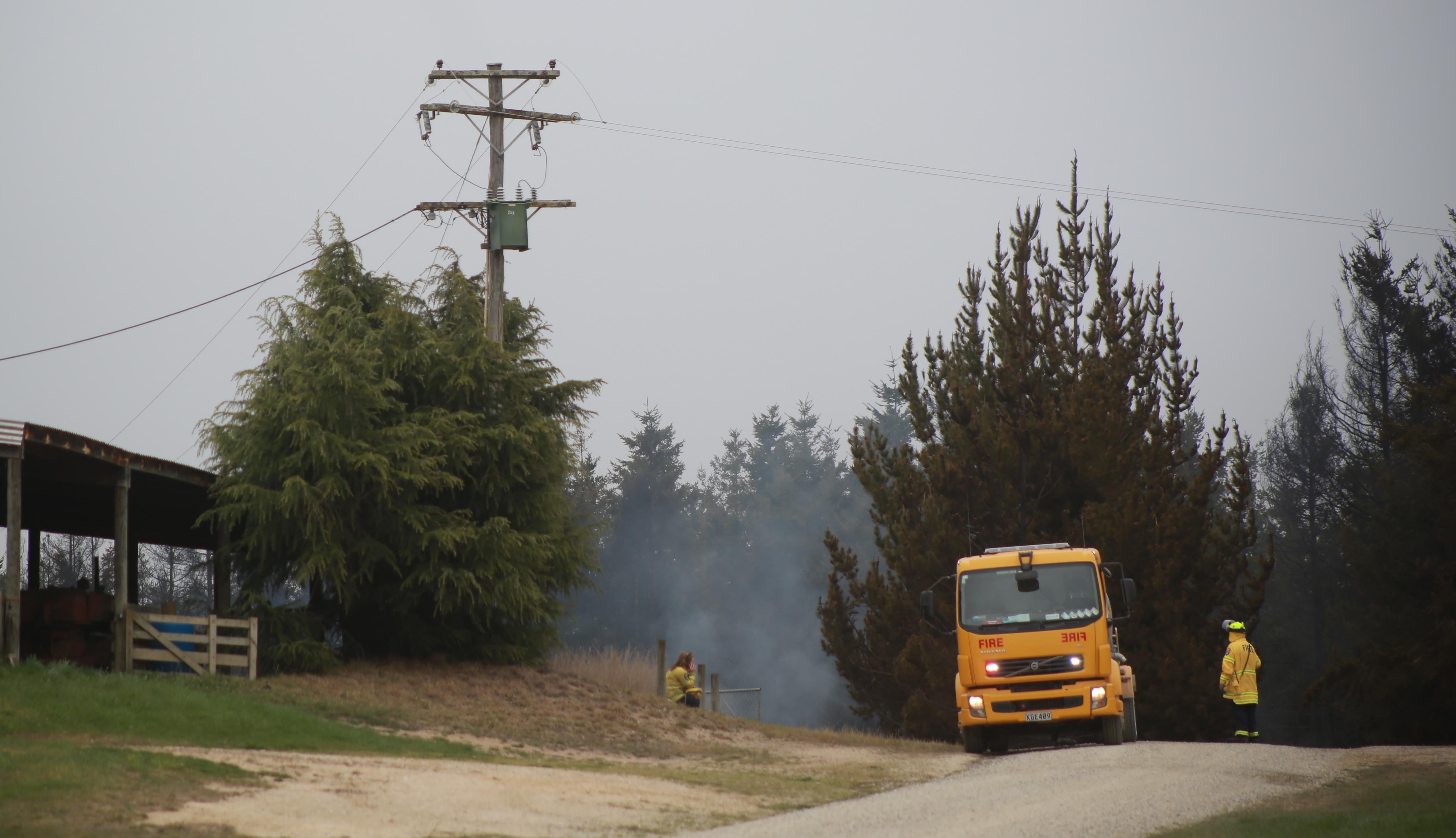 Firefighters work at the scene of the Livingstone blaze. Photo: Rebecca Ryan