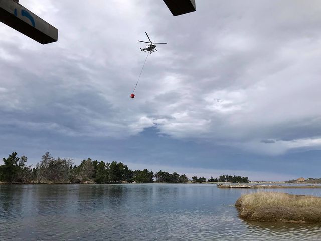 Helicopters were helping to fight the fire on Sunday afternoon. Photo: Simon White