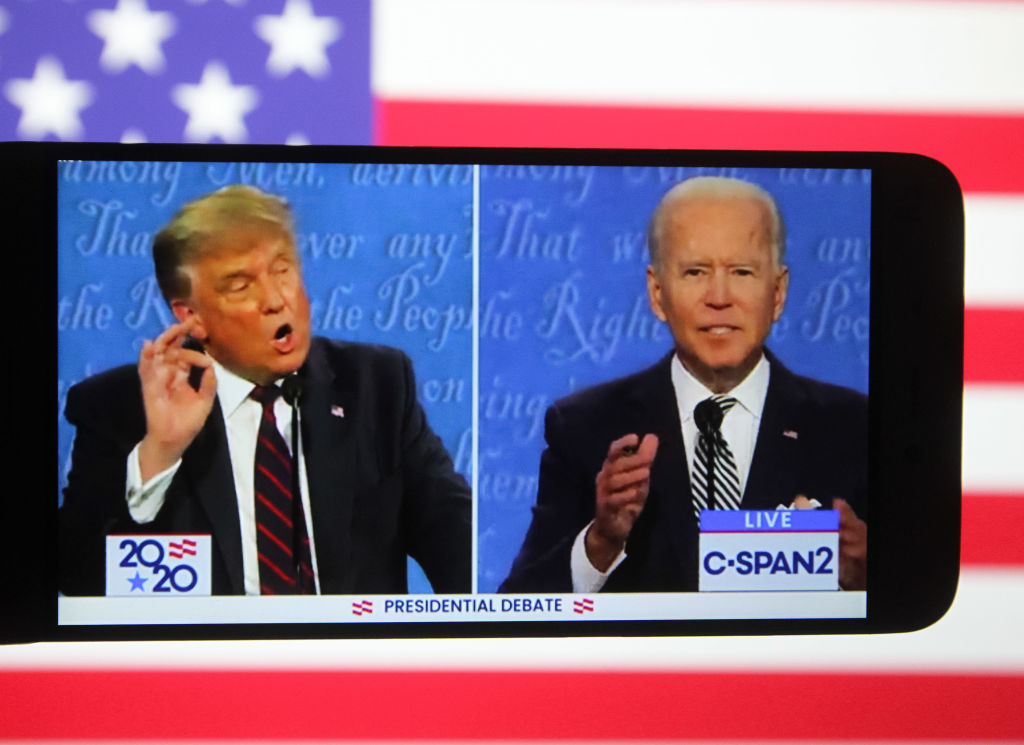 A smartphone screen shows US President Donald Trump (L) and Democratic presidential candidate Joe...