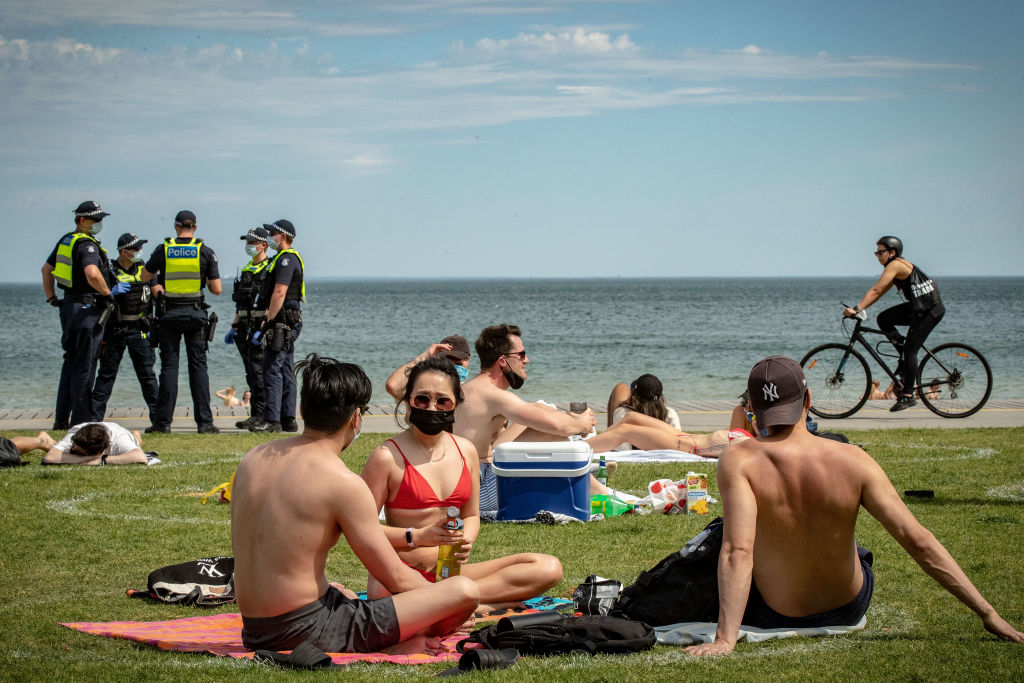 Police patrol at St Kilda Beach in Melbourne yesterday. Photo: Getty