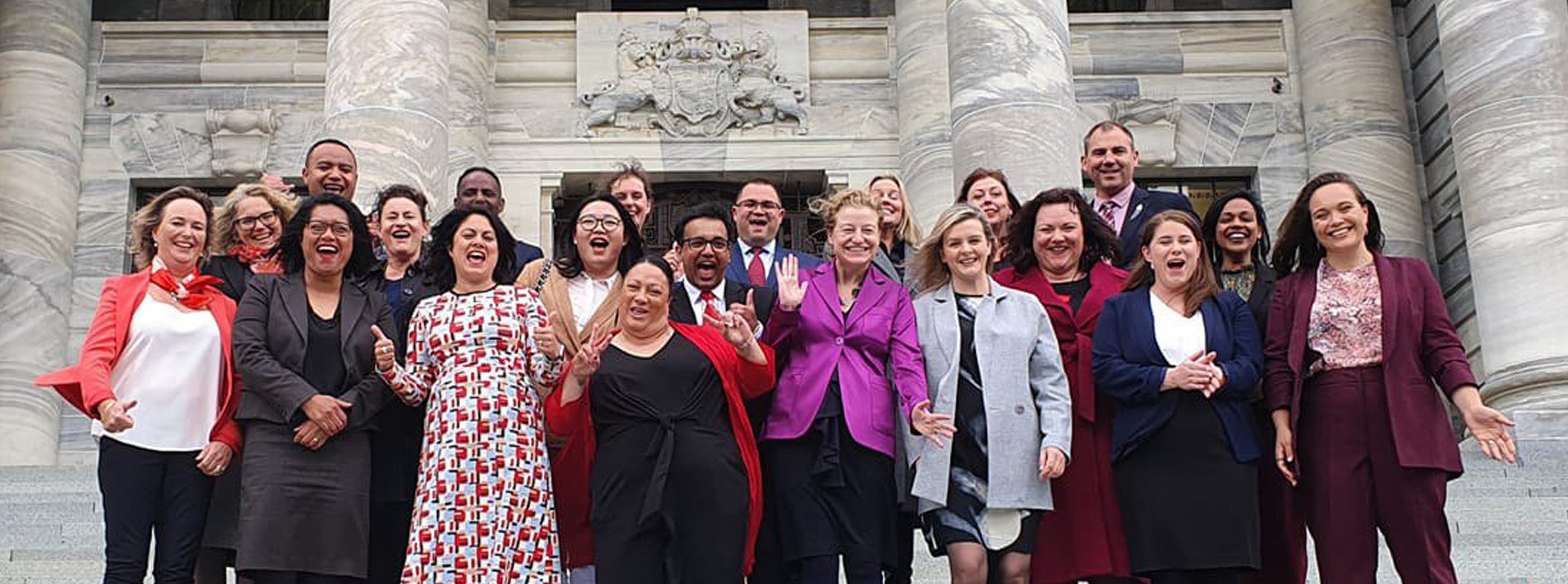 Newly-elected Labour Party MPs celebrate on the steps of Parliament in Wellington yesterday after...