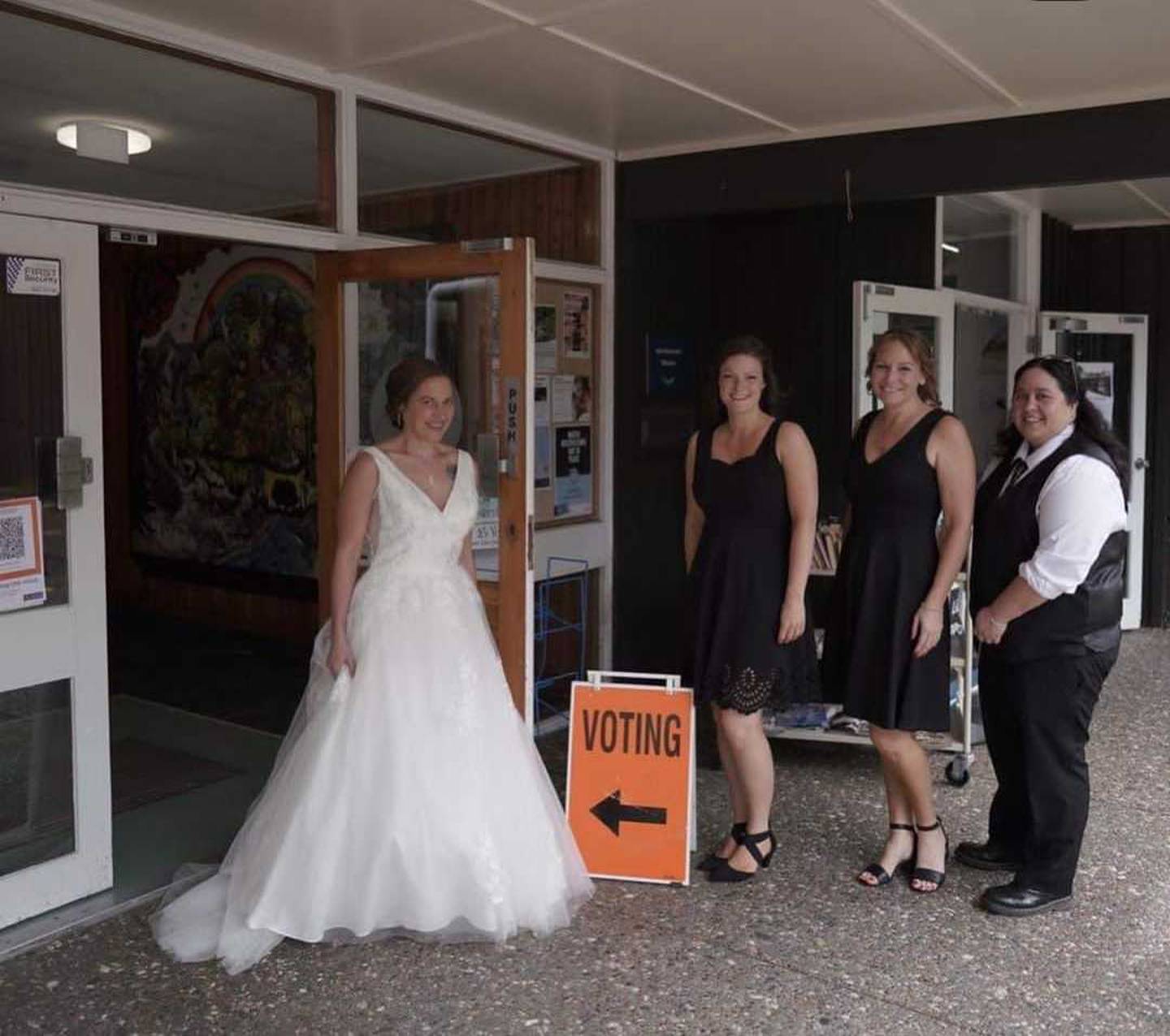 The bride voted accompanied by her bridesmaids. Photo / Ethan Lowry Photography