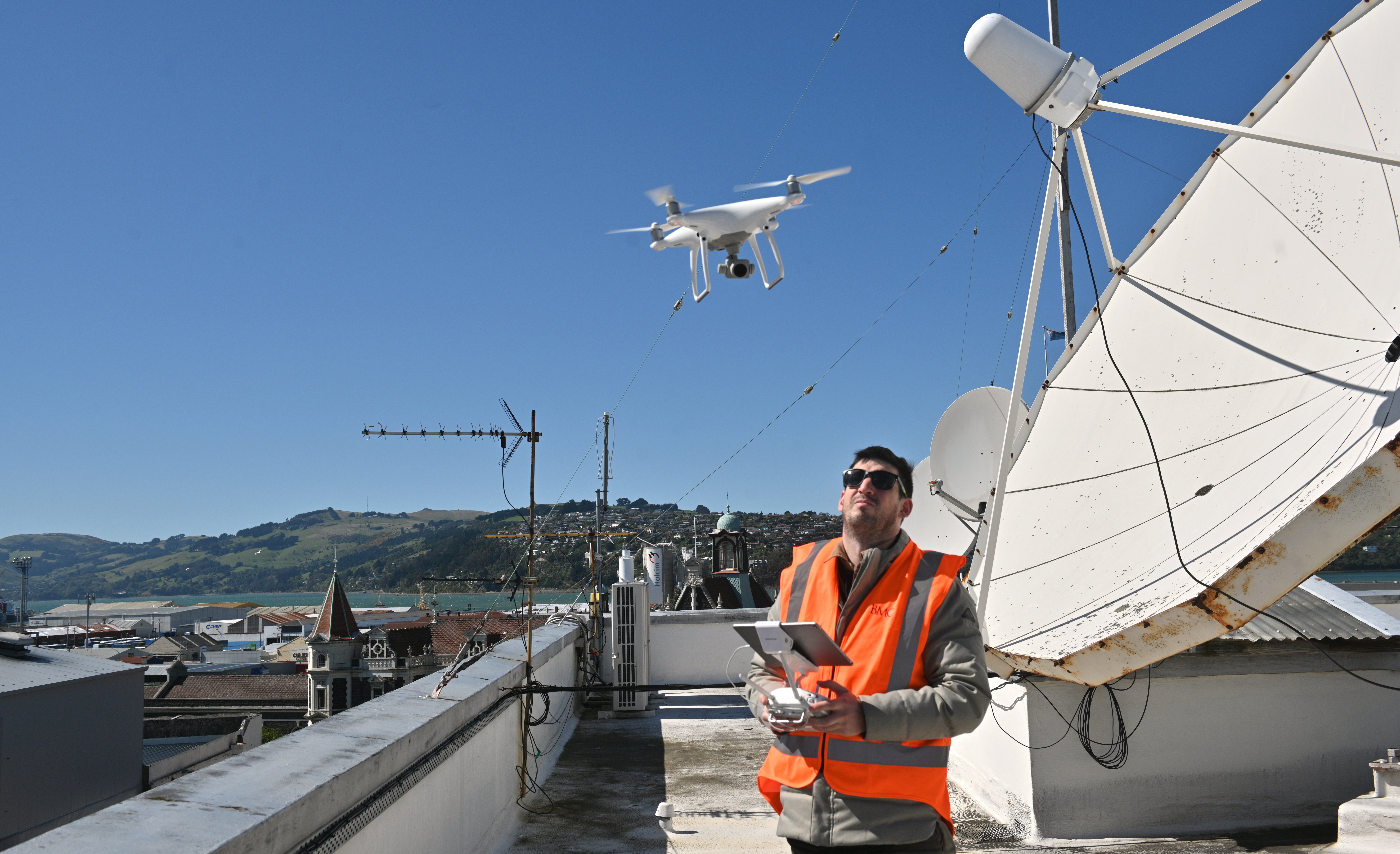 Batchelar McDougall Consulting geospatial technician Trevor Cray operates a drone from the roof...