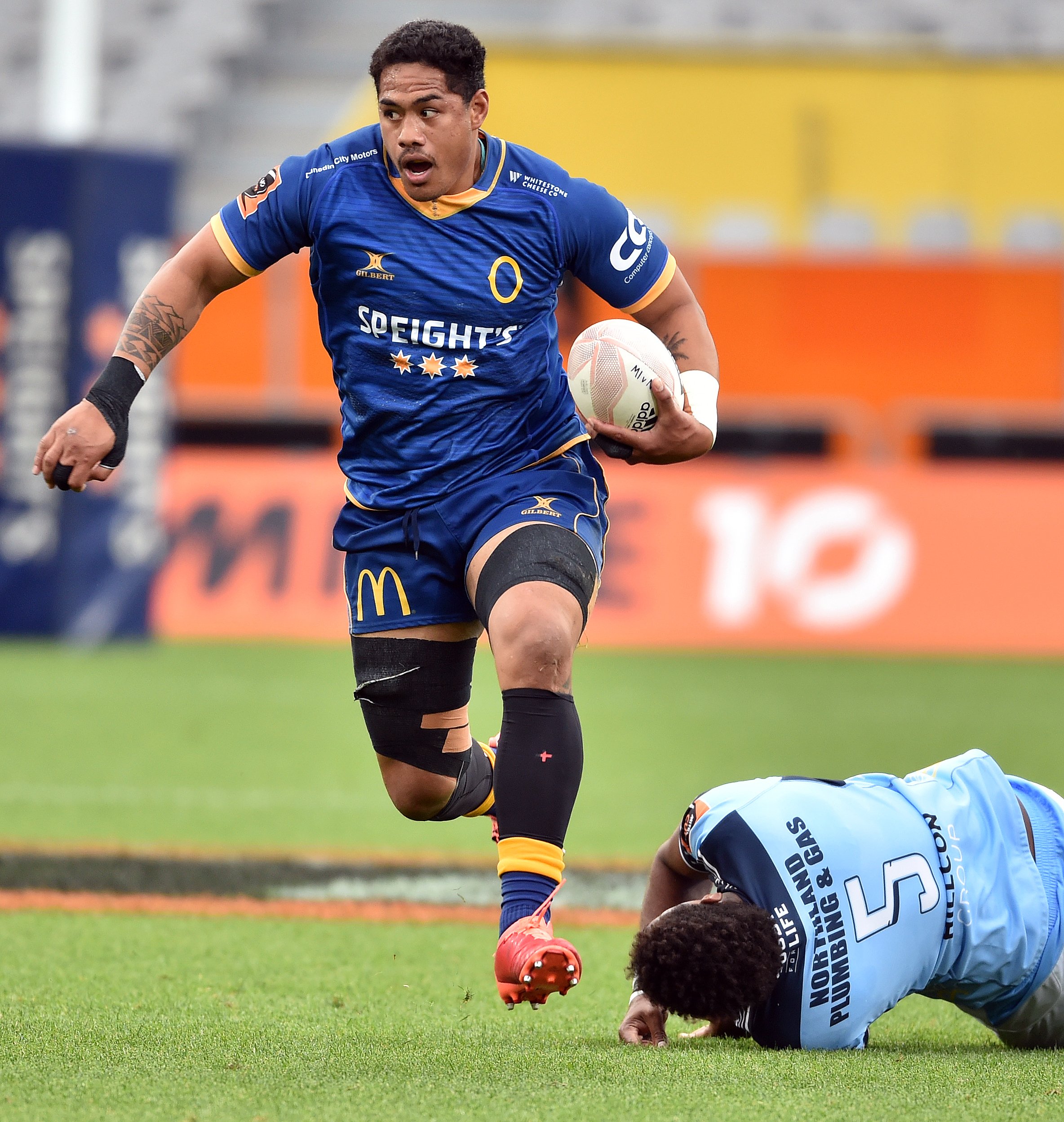 Otago No 8 Sione Misiloi gets away from Northland lock Temo Mayanavanua at Forsyth Barr Stadium...
