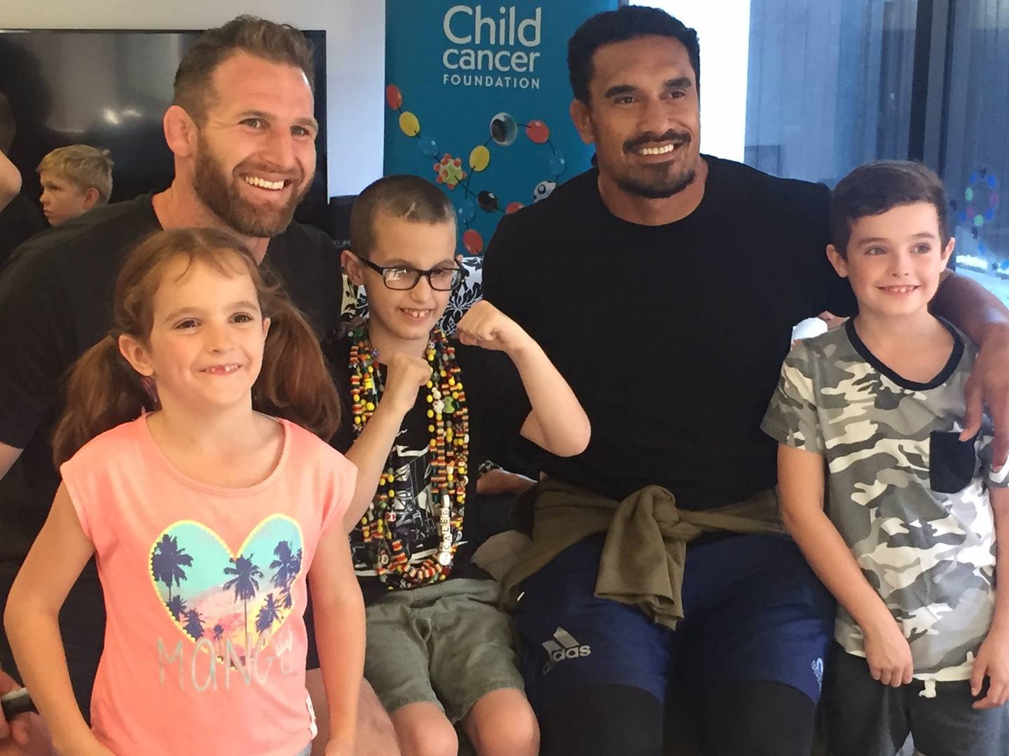 Caleb Wright, centre, pictured with former All Blacks Kieran Read and Jerome Kaino, and Brooke...