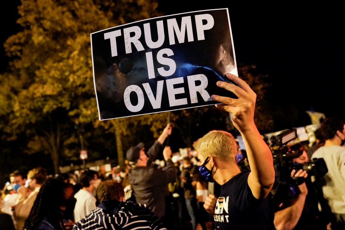 People celebrate at Black Lives Matter Plaza in Washington after media declared Joe Biden the...