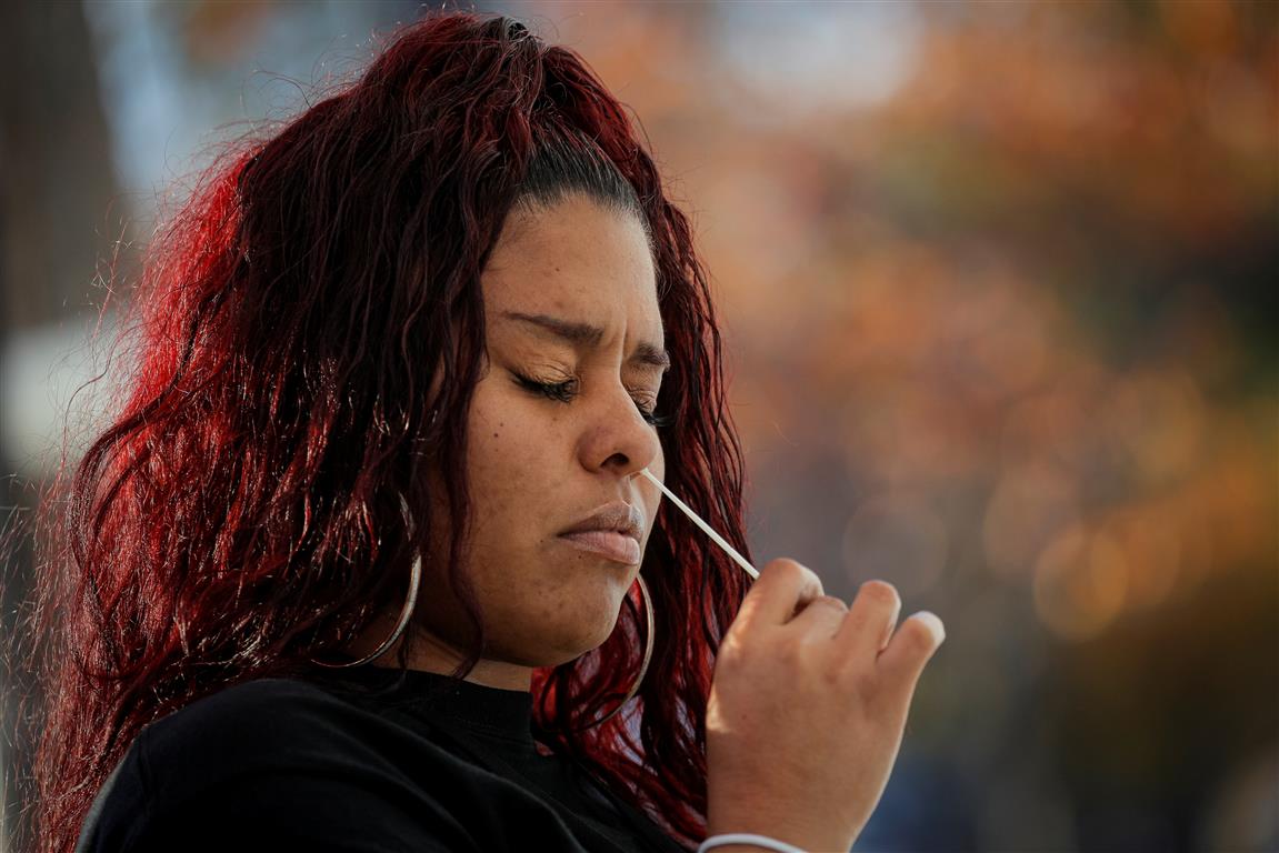 A woman takes a Covid-19 test in Staten Island, New York. Photo: Reuters