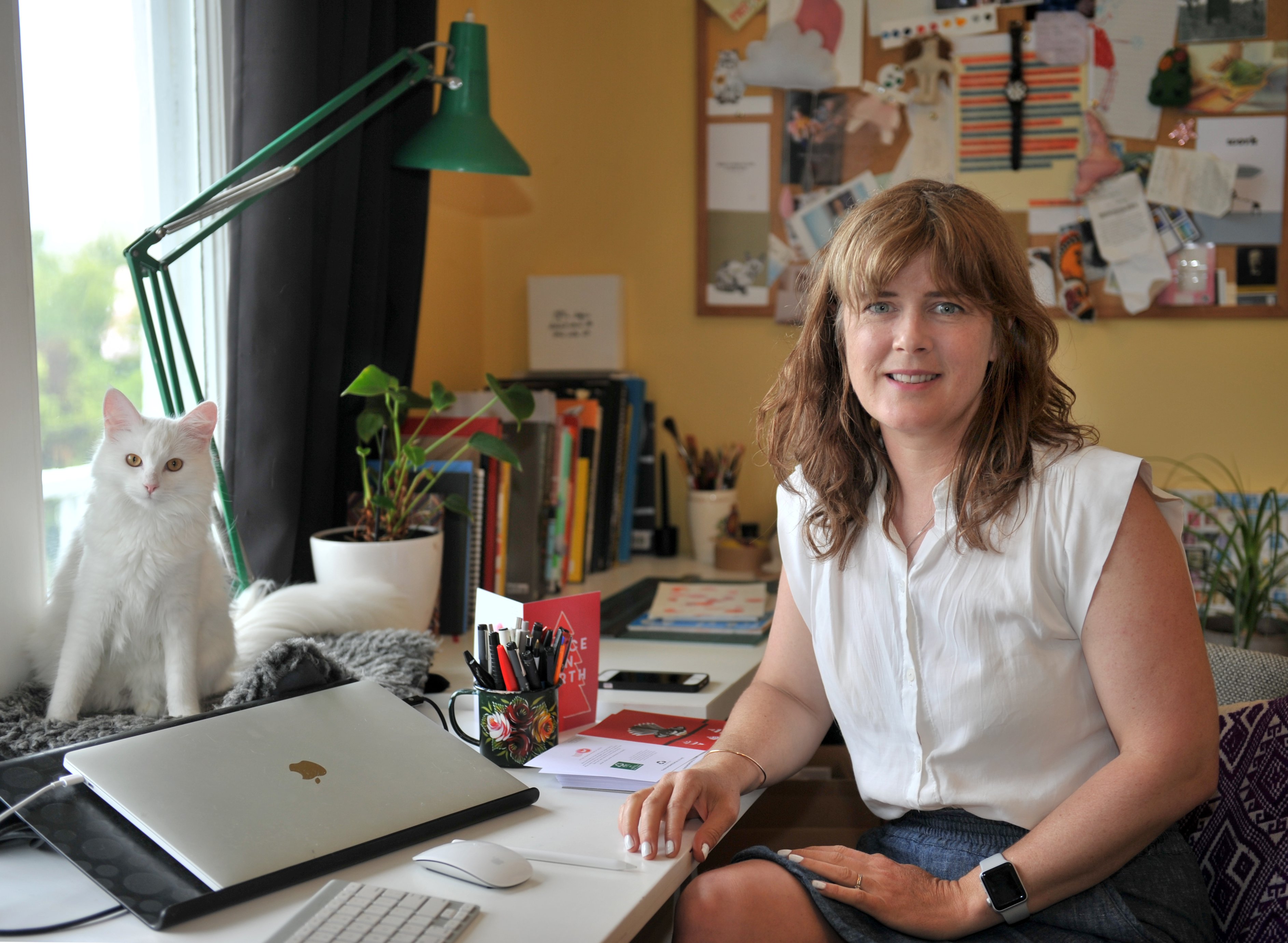 Bronwen Hurford, co-founder of The Paper People, in her home office with her Covid-19 rescue cat...