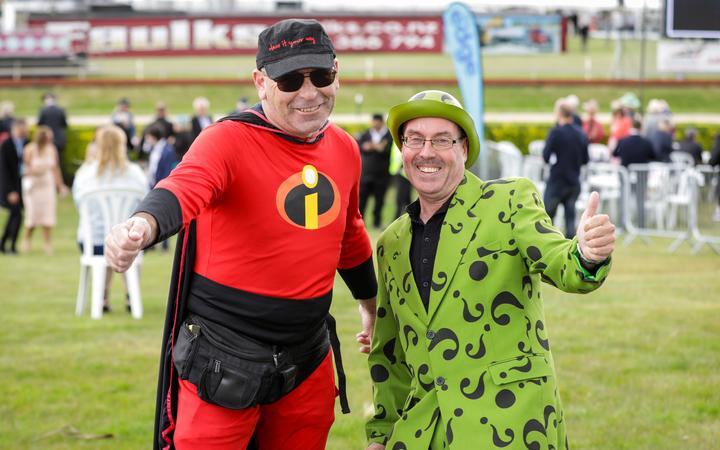 Mike Willetts, wearing a Mr Incredible costume and David Garters, dressed as The Riddler. Photo:...