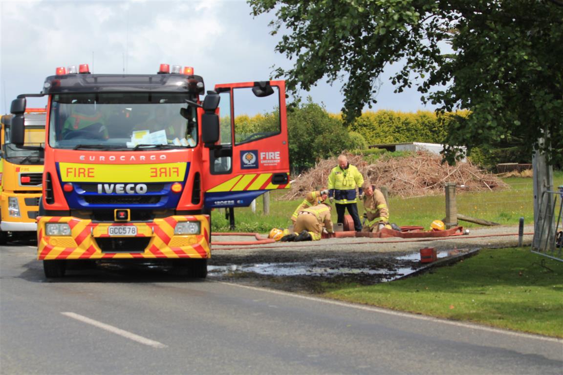 Firefighters at the scene this afternoon. Photo: Karen Pasco