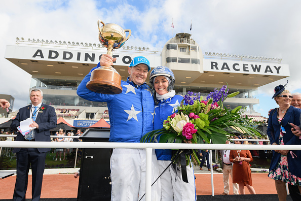 Mark Purdon driving Self Assured and trainer Natalie Rasmussen celebrate after winning Race 11...