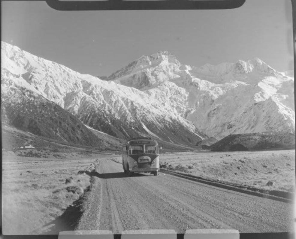 Mount Cook and Southern Lakes Tourist Coach on the Hermitage Road, Mount Cook Village, with Mount...