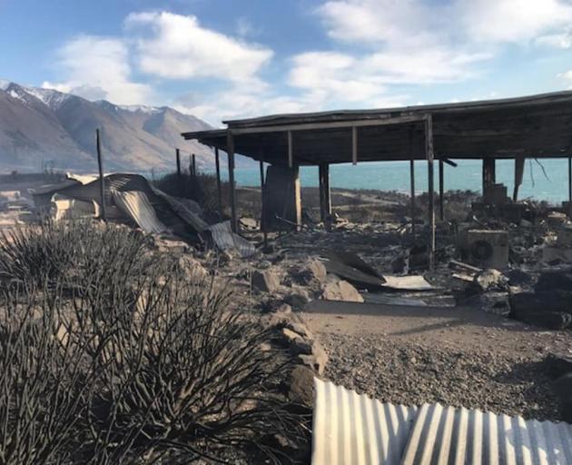 A fire-ravaged remains of a house near the shore of Lake Ohau. Photo: Supplied