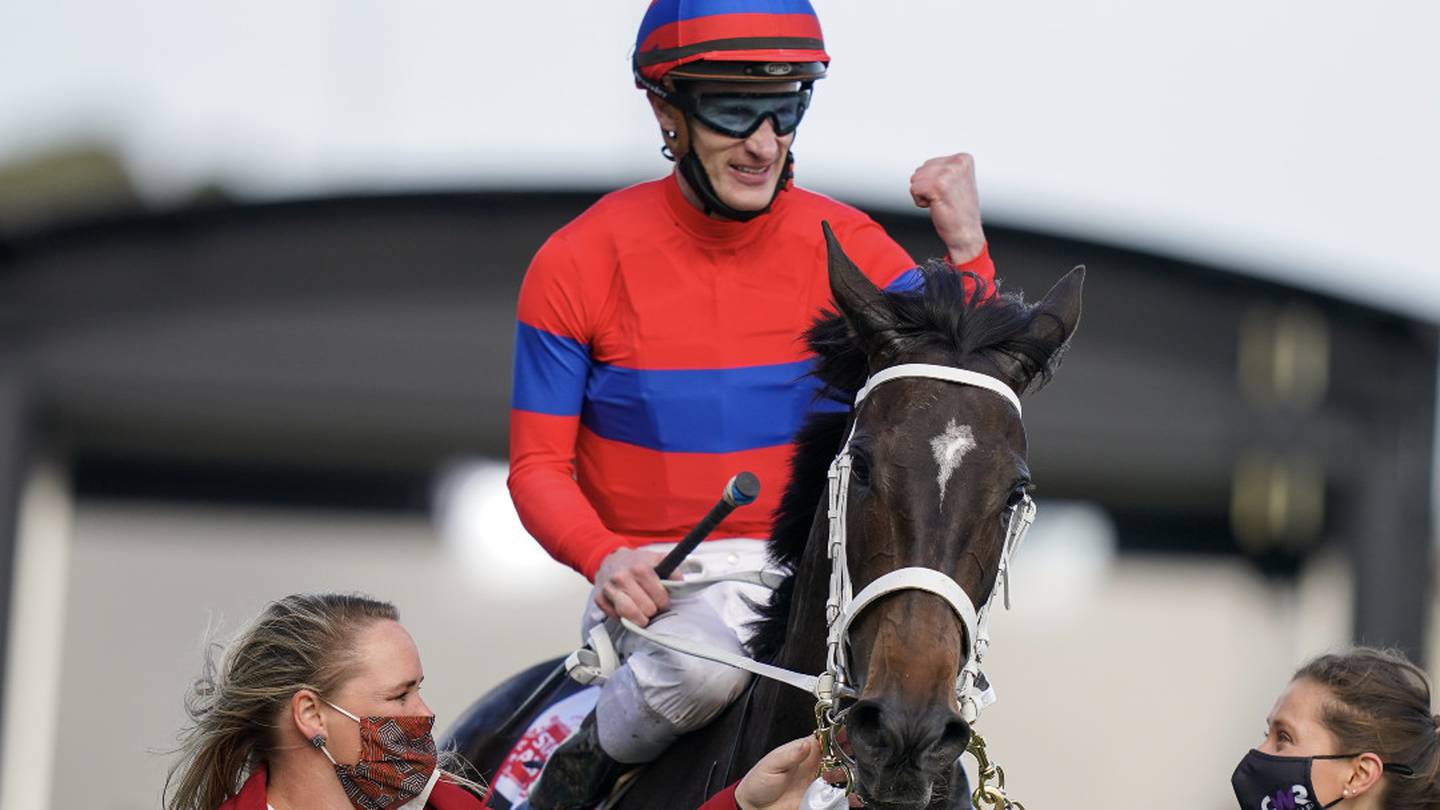 Jockey Mark Zahra celebrates aboard Verry Elleegant after winning the Caulfield Cup. Photo: Getty...