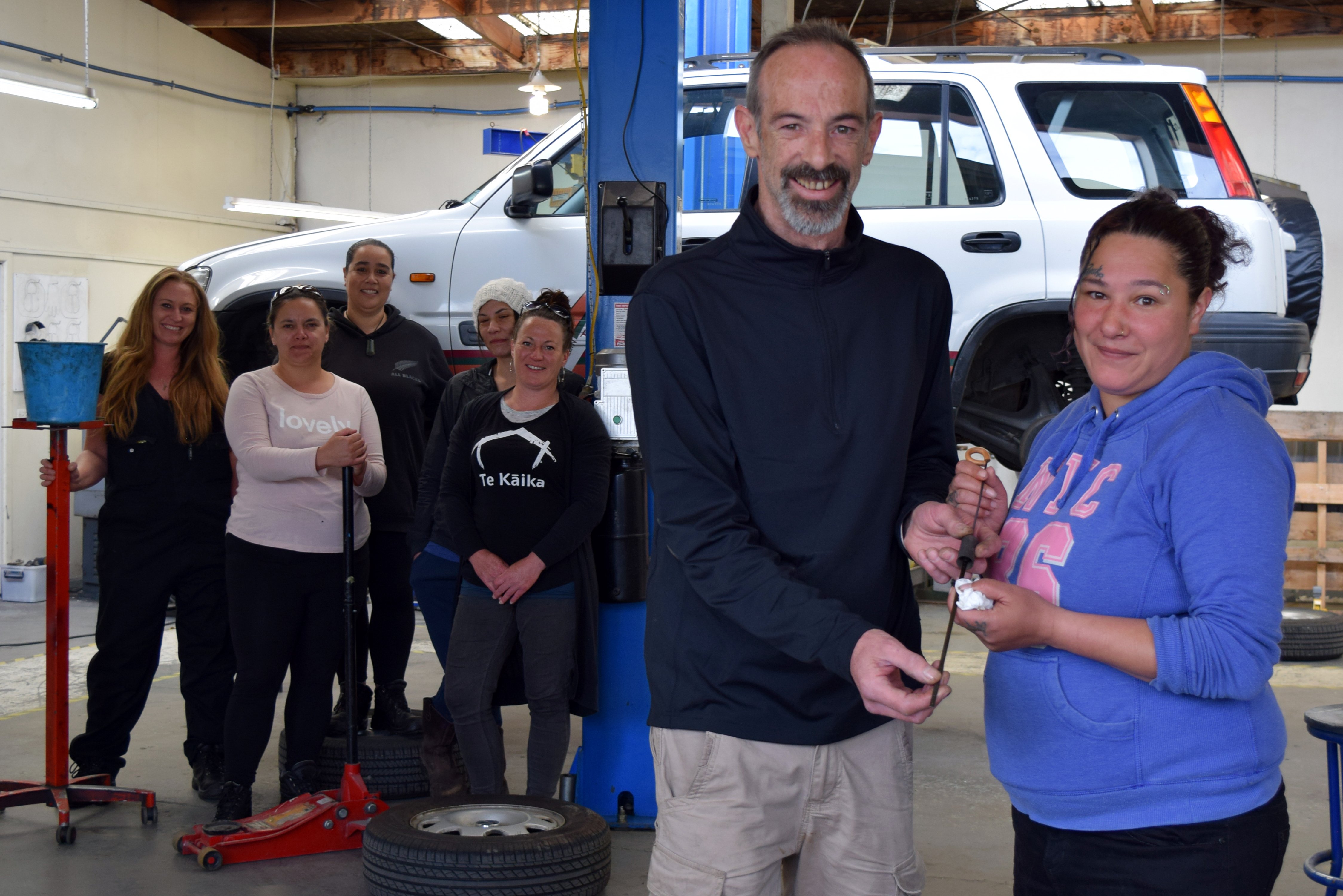 Dunedin Training Centre automotive supervisor Ross Forsyth checks the oil level on a dipstick...