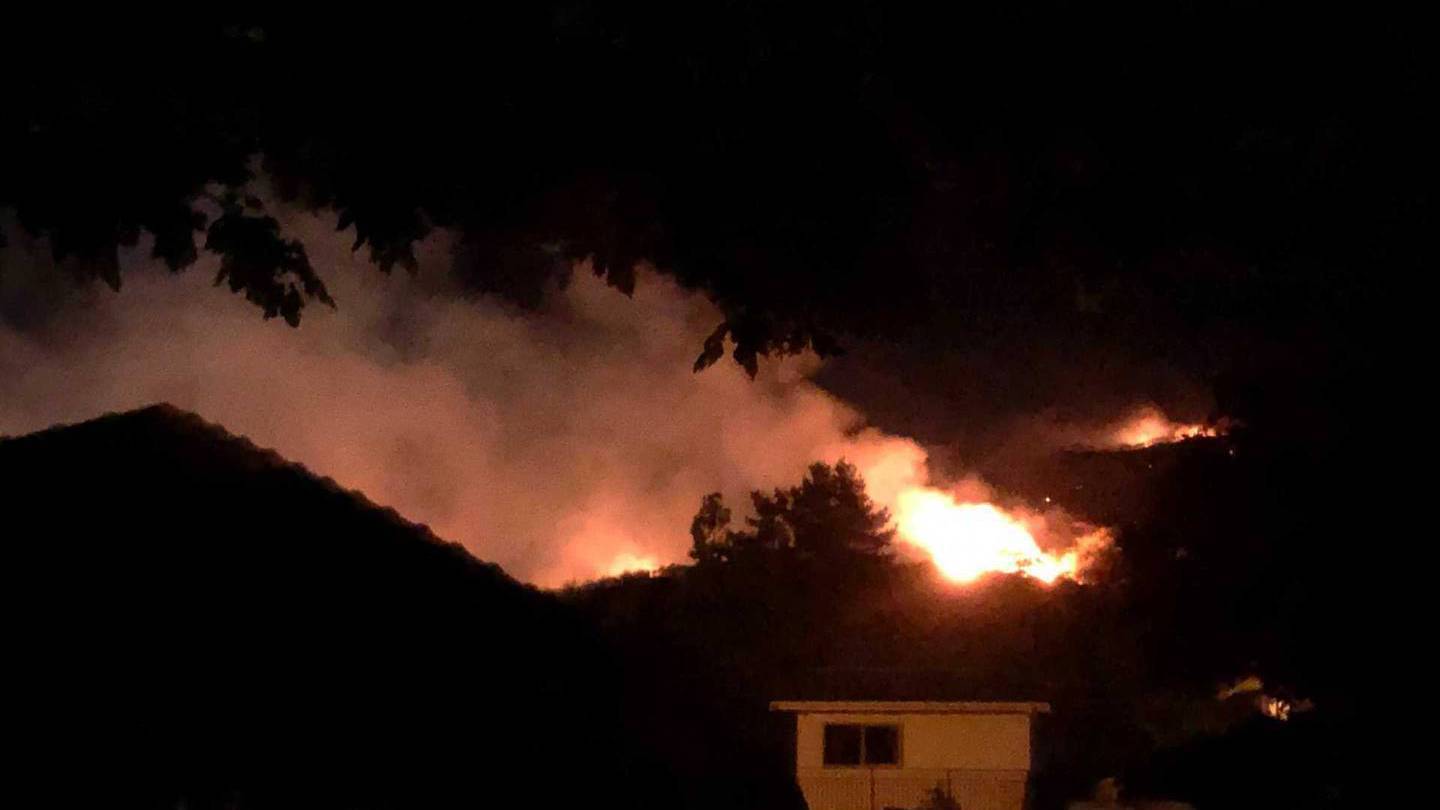 Flames could be seen through the night during a fire on the Port Hills on Friday. Photo: Hamish...