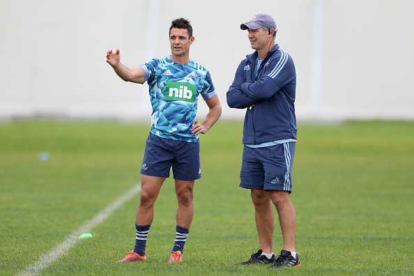 Dan Carter and Leon MacDonald. Photo: Getty Images