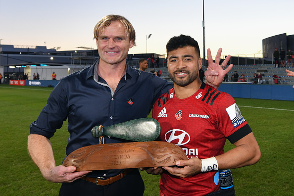 Scott Robertson and Richie Mo'unga with the Super Rugby Aotearoa Trophy. Photo: File / Getty Images