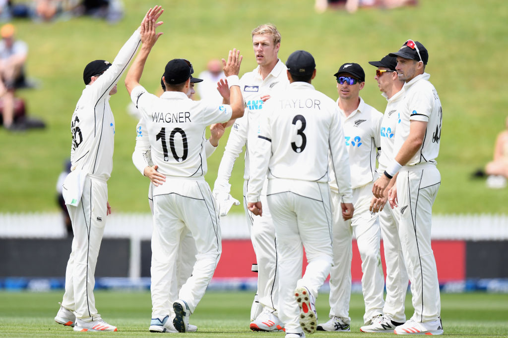 Kyle Jamieson (c) is congratulated by his New Zealand teammates after dismissing the West Indies'...