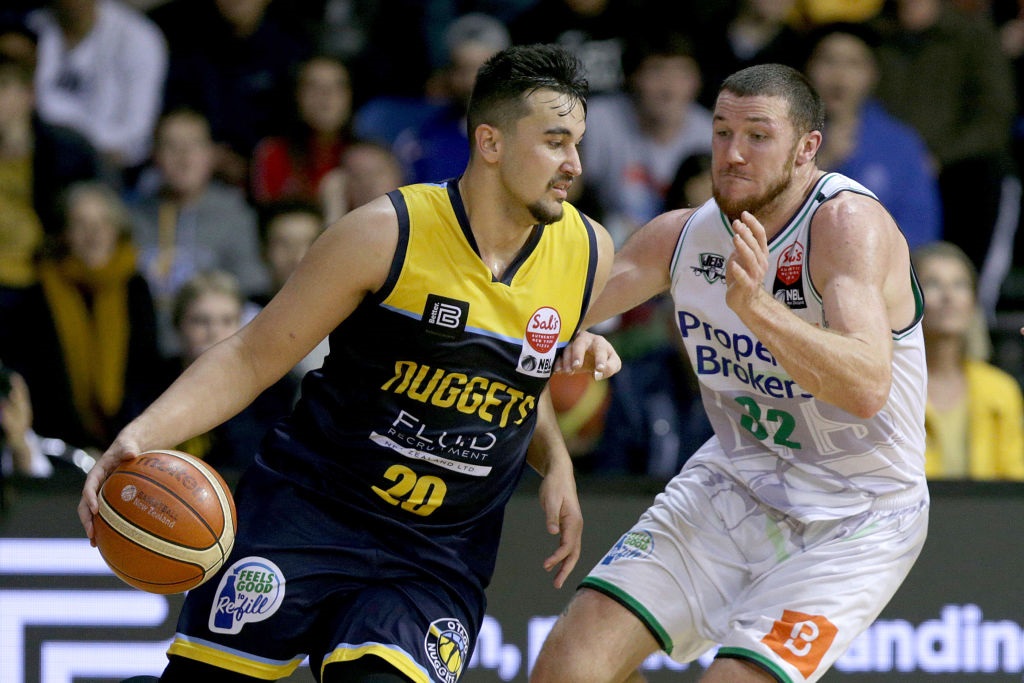 Kane Keil drives at Tom Vodanovich during this year's NBL Showdown final between the Otago...