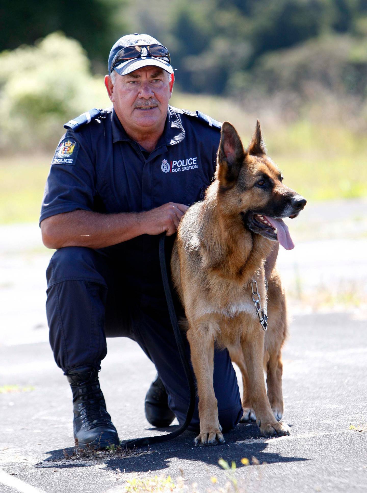 Senior Constable Ross Clarke and detector dog Archie in 2013. Photo: Michael Cunningham