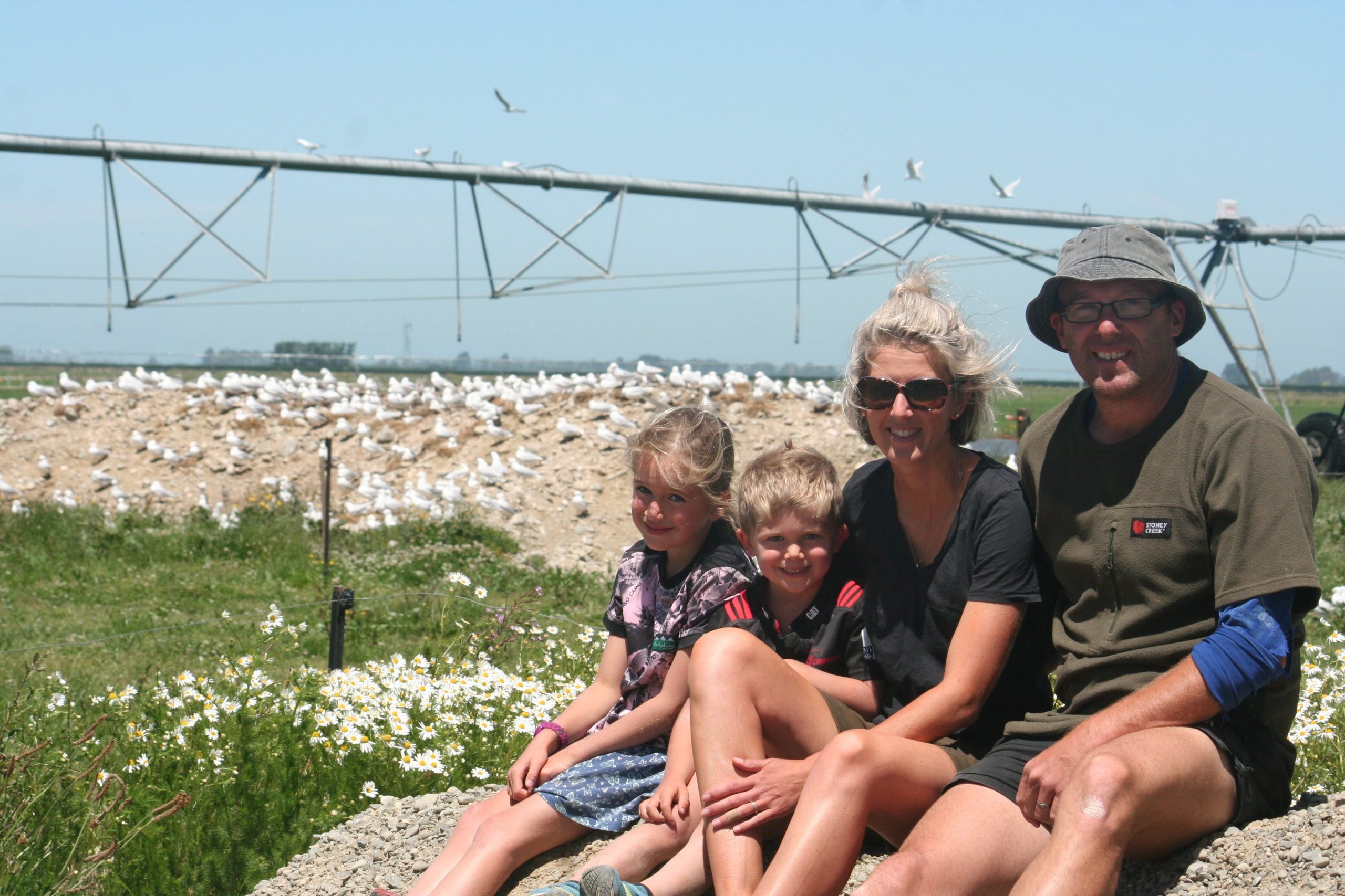 Dairy farmers Ali Van Polanen and Andrew Black with their children Florence and Hudson are happy...