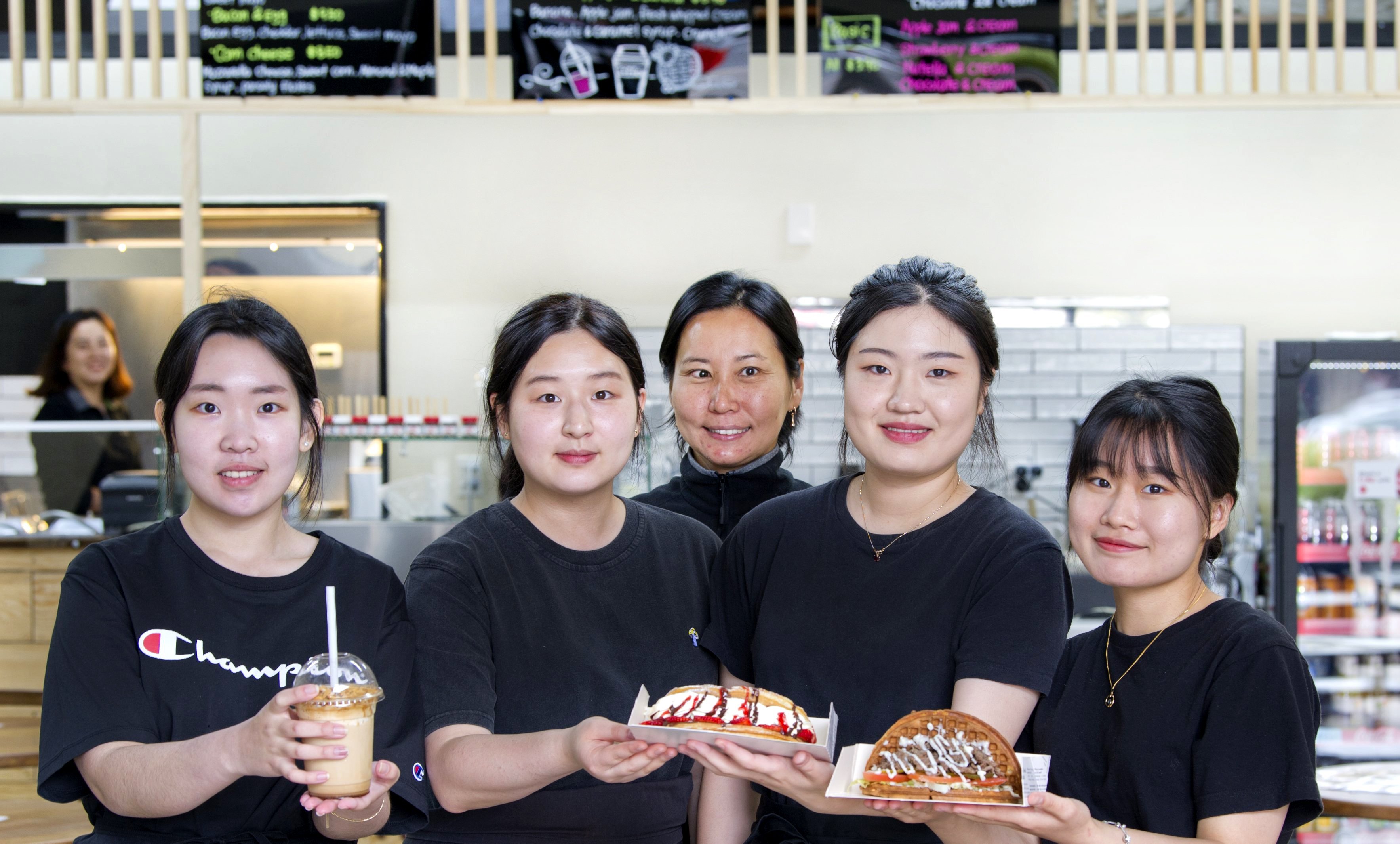 Crazy Waffle staff members (from left) Louise Kim, Hamin Yun, Ellie Jung, Lily Kim and Na Hyun...