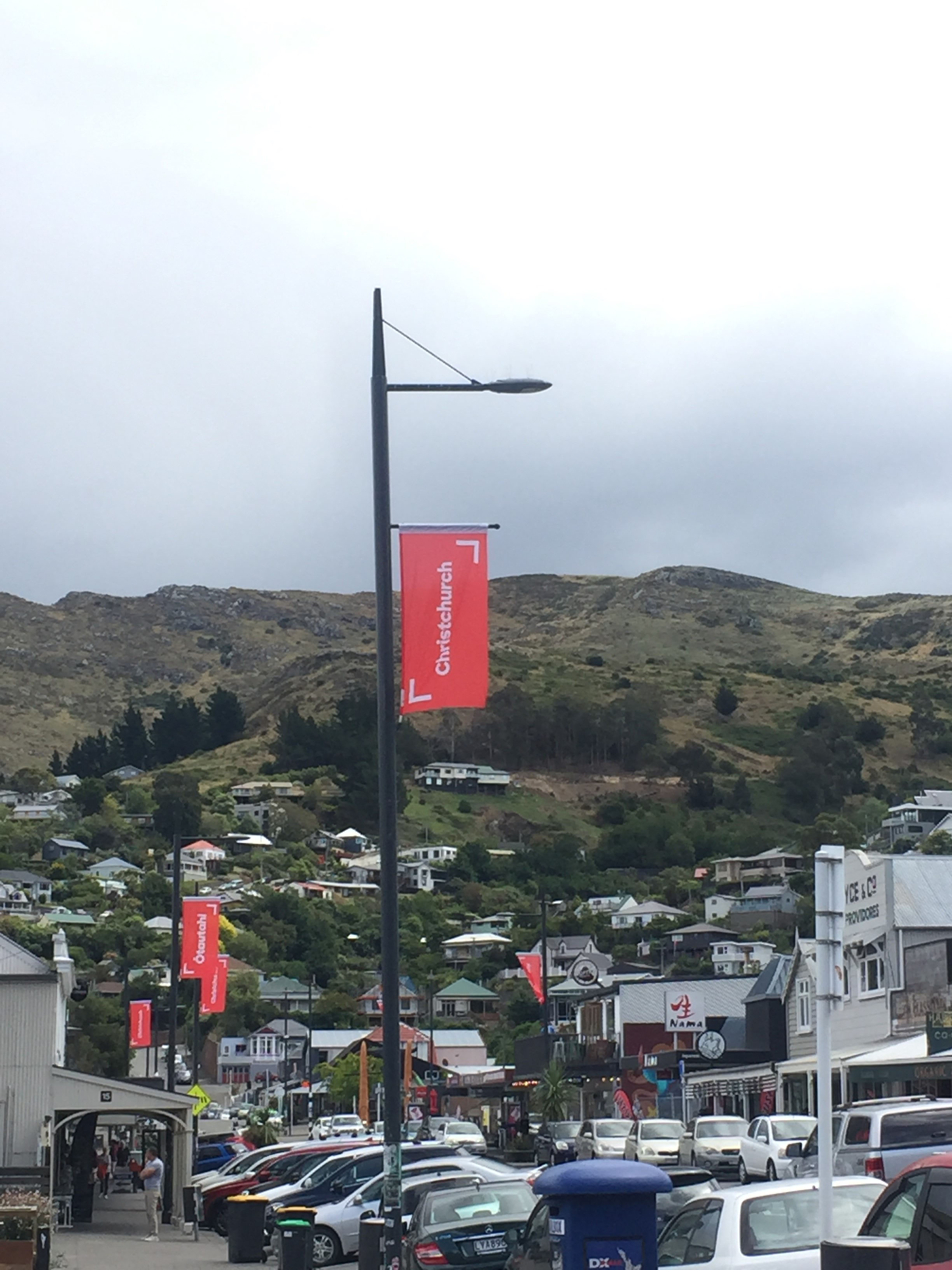 The Ōtautahi and Christchurch flags line the port’s streets. Residents argue they should be...