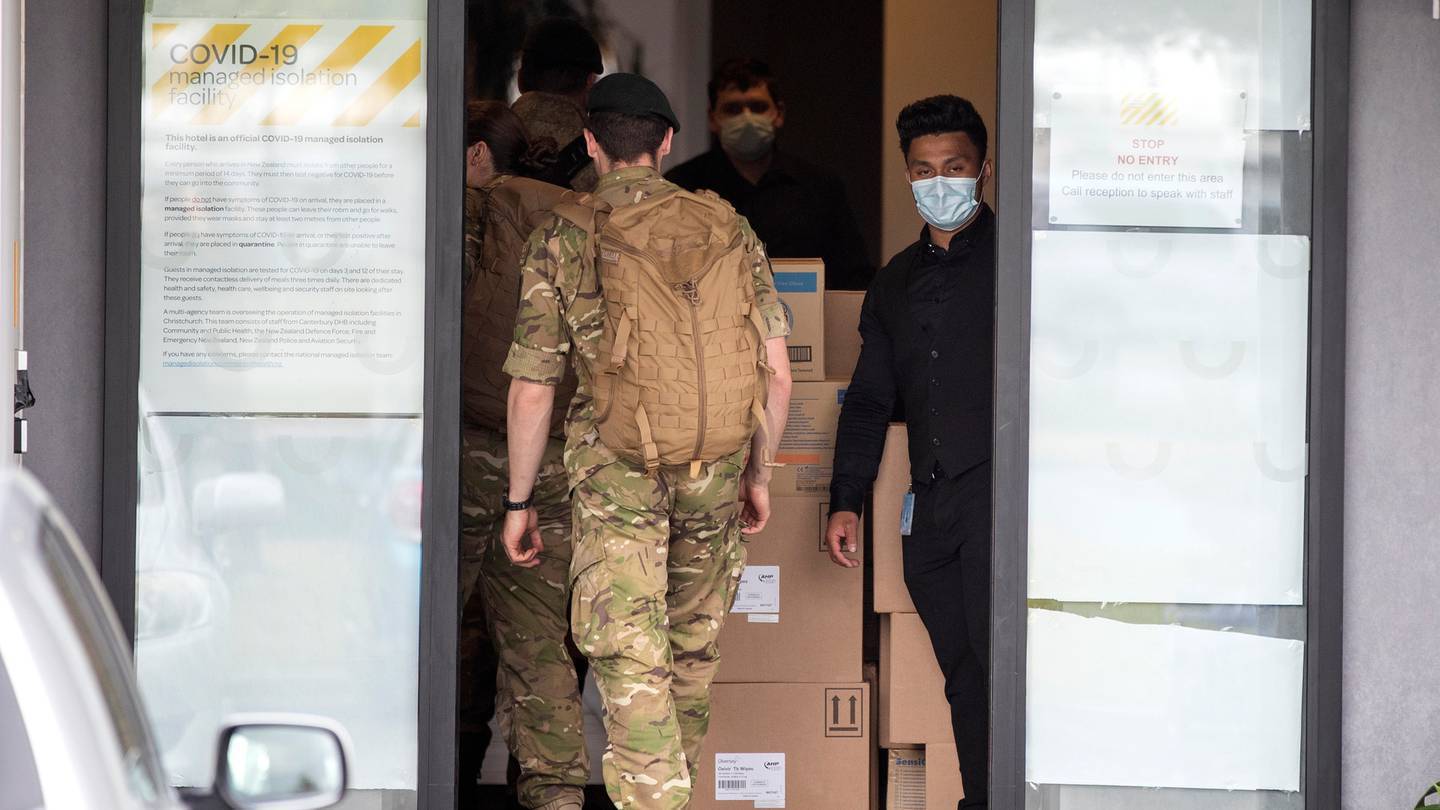 Military personnel enter the Sudima Hotel in Christchurch. Photo: NZH