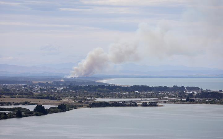 A fire at Pines Beach, near Kaiapoi north of Christchurch, on Monday. Photo: RNZ