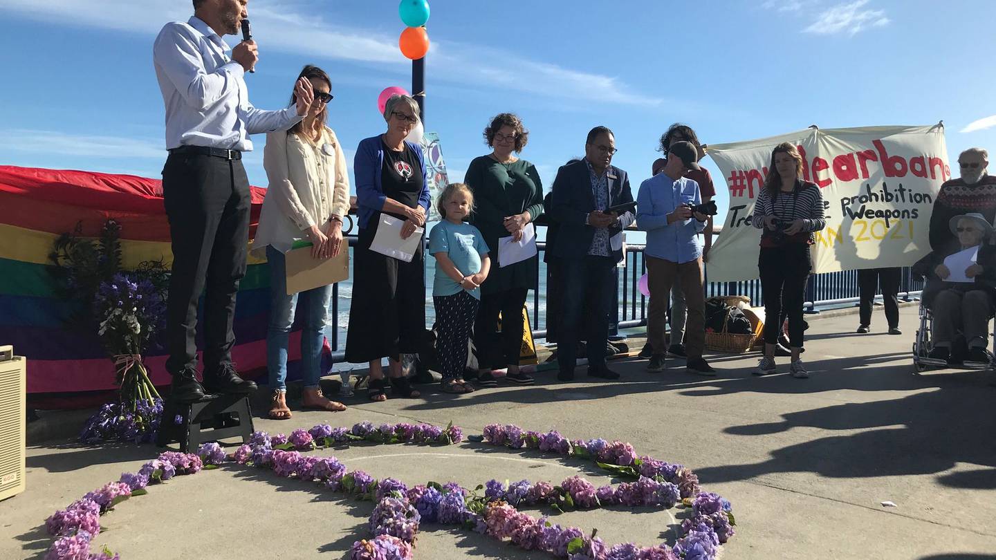 Anti-nuclear protesters gather at New Brighton beach on Friday. Photo: Tim Cronshaw