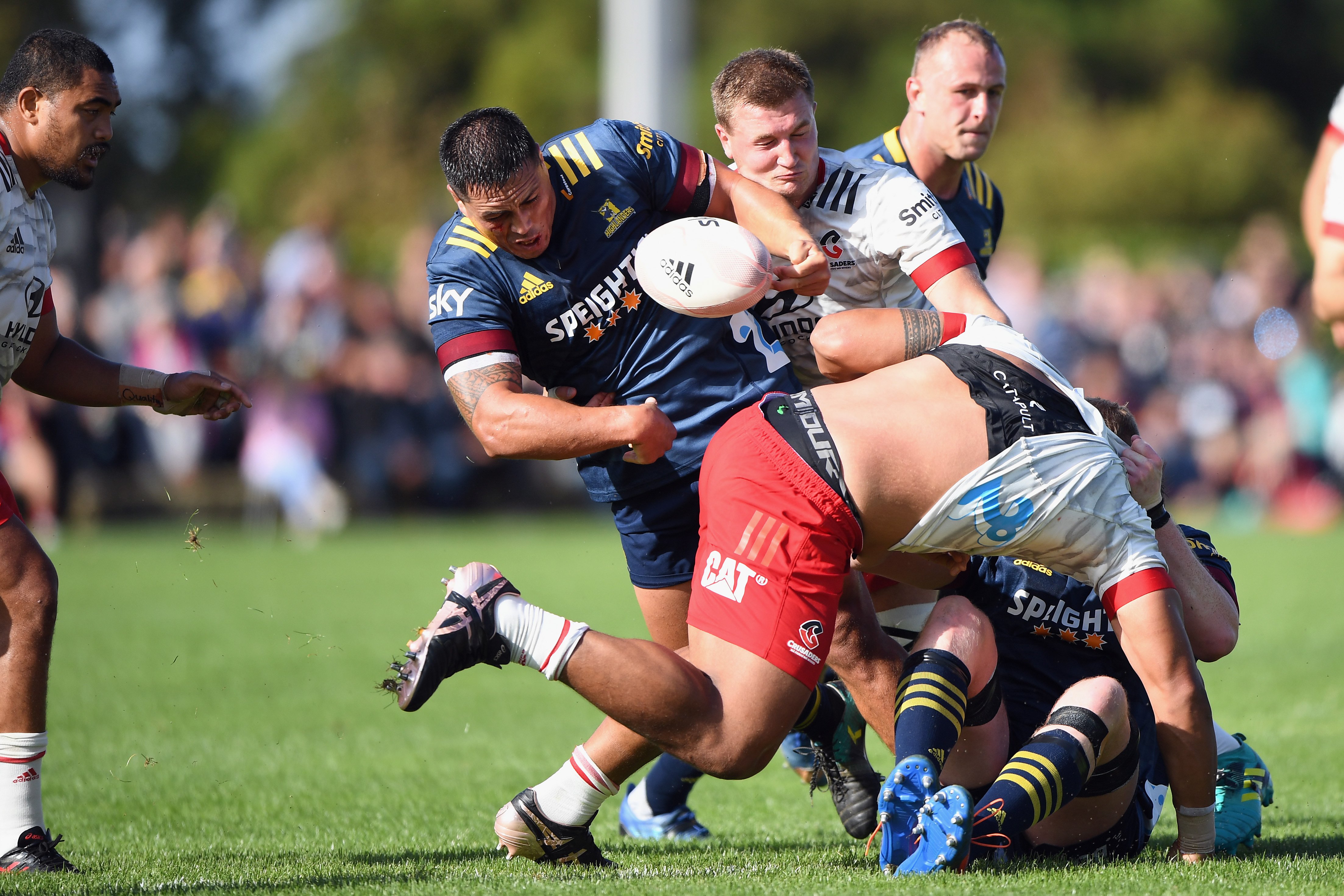 Highlanders prop Daniel Lienert-Brown tries to get away from Crusaders lock Will Tucker. PHOTO:...