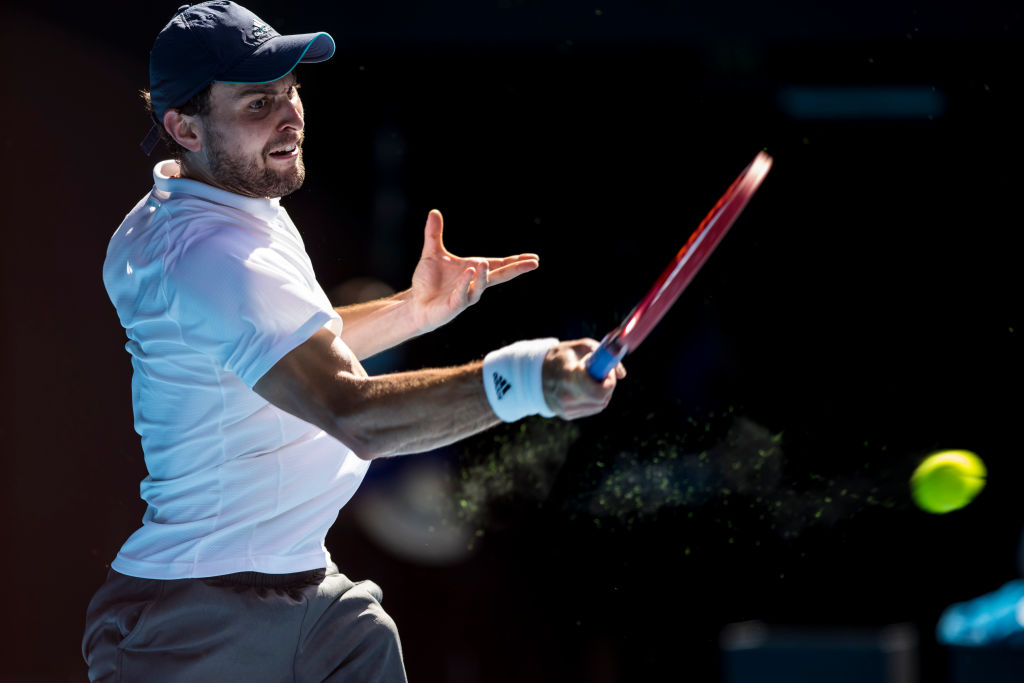 Aslan Karatsev of Russia returns the ball during the quarterfinal match with Grigor Dimitrov. Photo: Getty Images