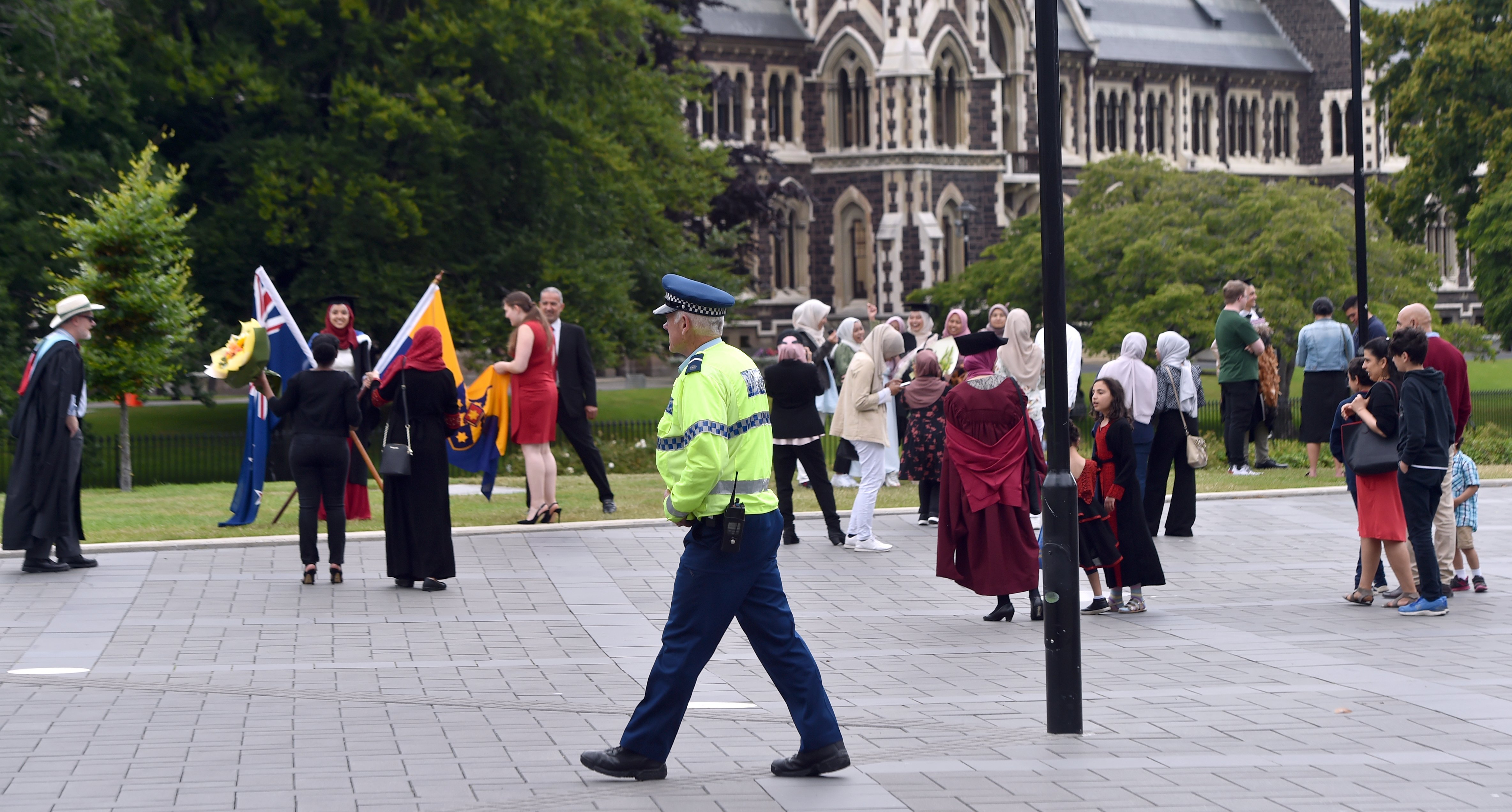 Police were present on campus as students took graduation photos last December, following the...