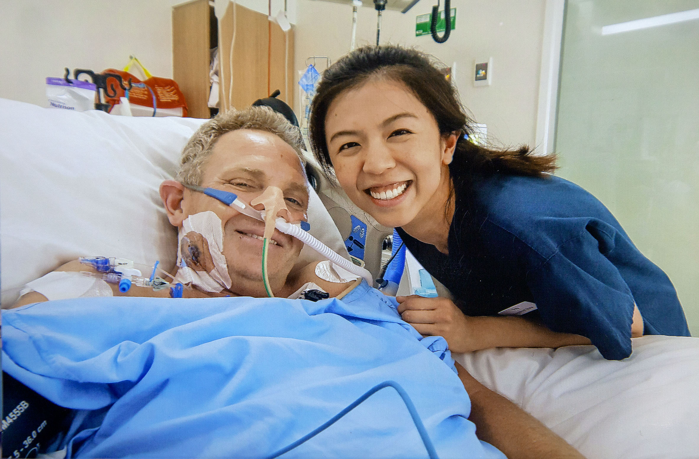 Mark Bone with a theatre nurse in Melbourne. Photo: Supplied