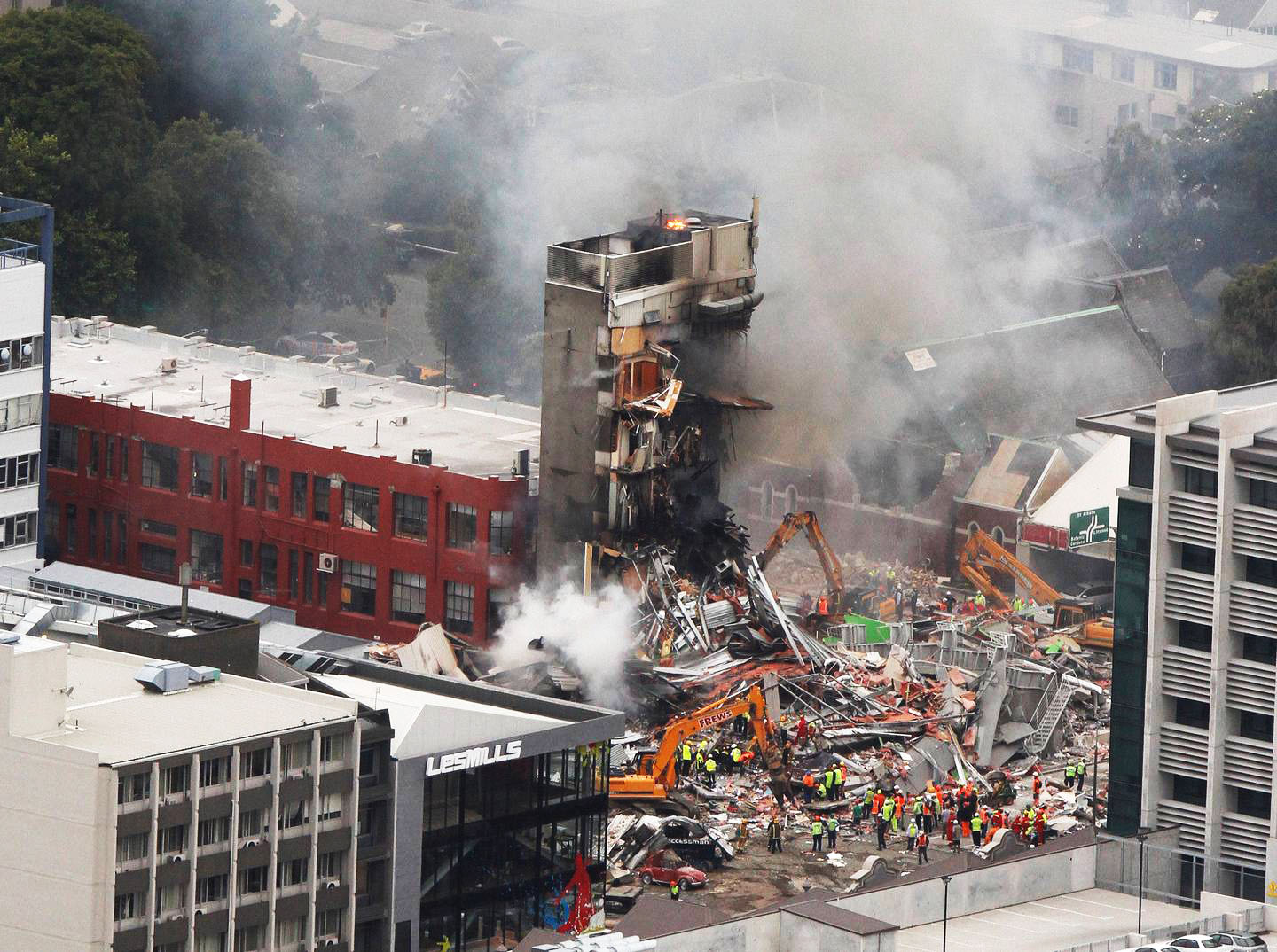 Firefighters, police and other search and rescue crews at work on the collapsed CTV building in...