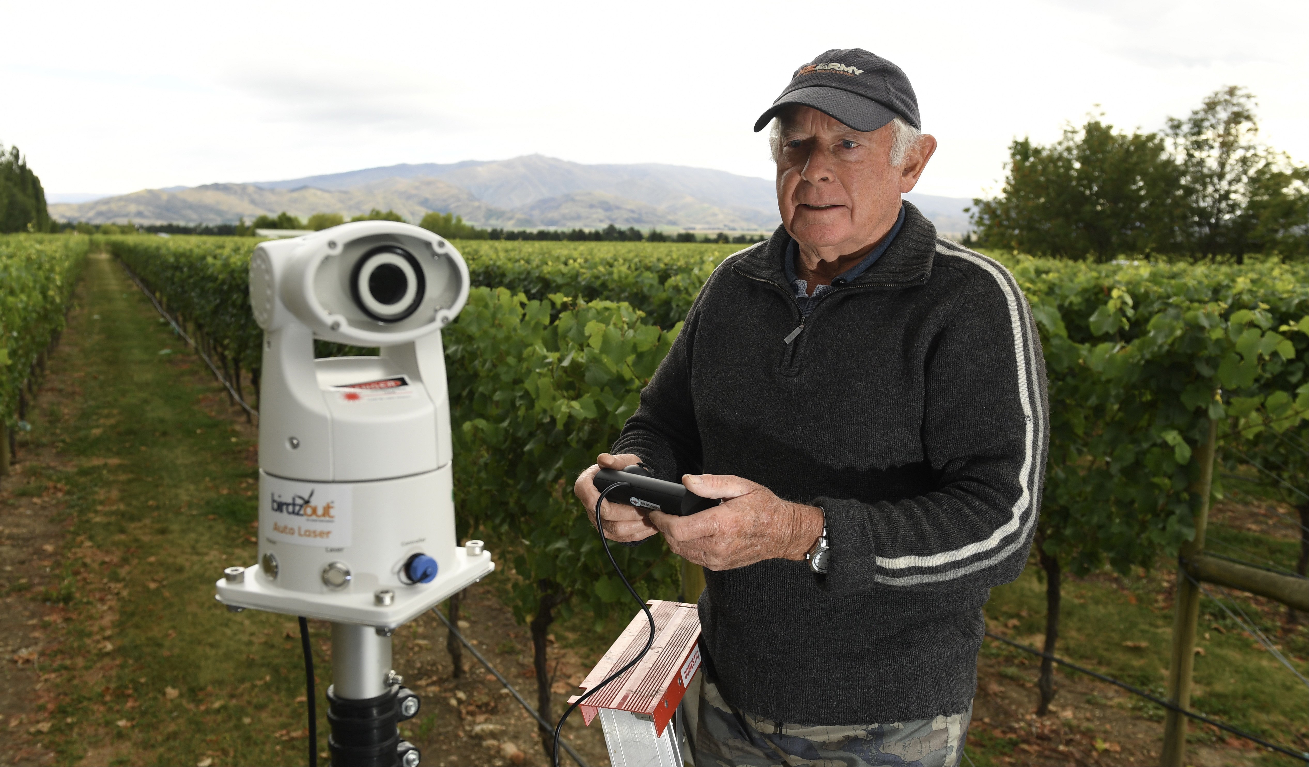 Viticulturist Barry Hunt with ‘‘Birdzout’’ auto bird scare laser to be used at Ewing Stevens’...