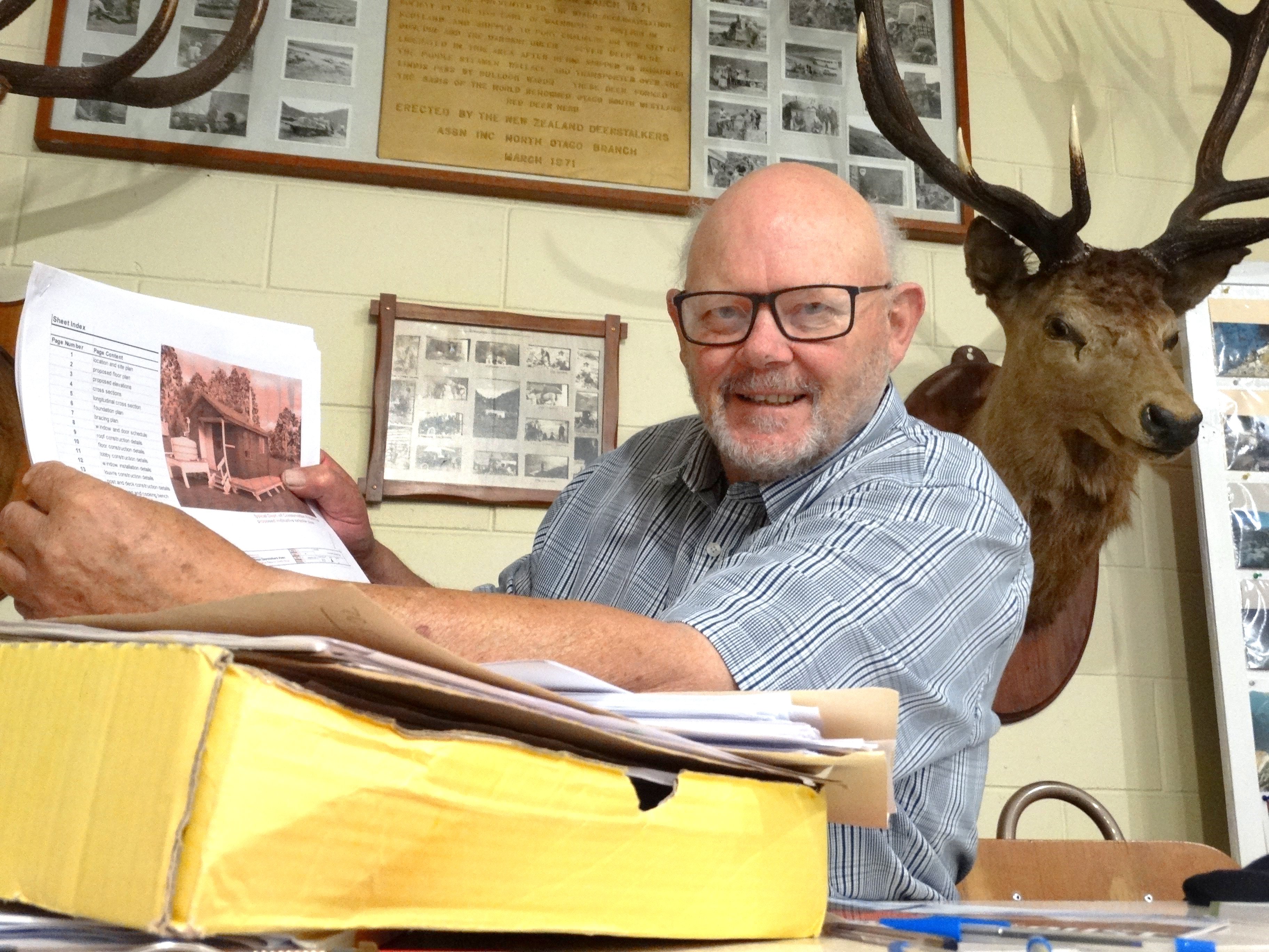 Looking through hut plans at the New Zealand Deerstalkers Association North Otago branch hall in...